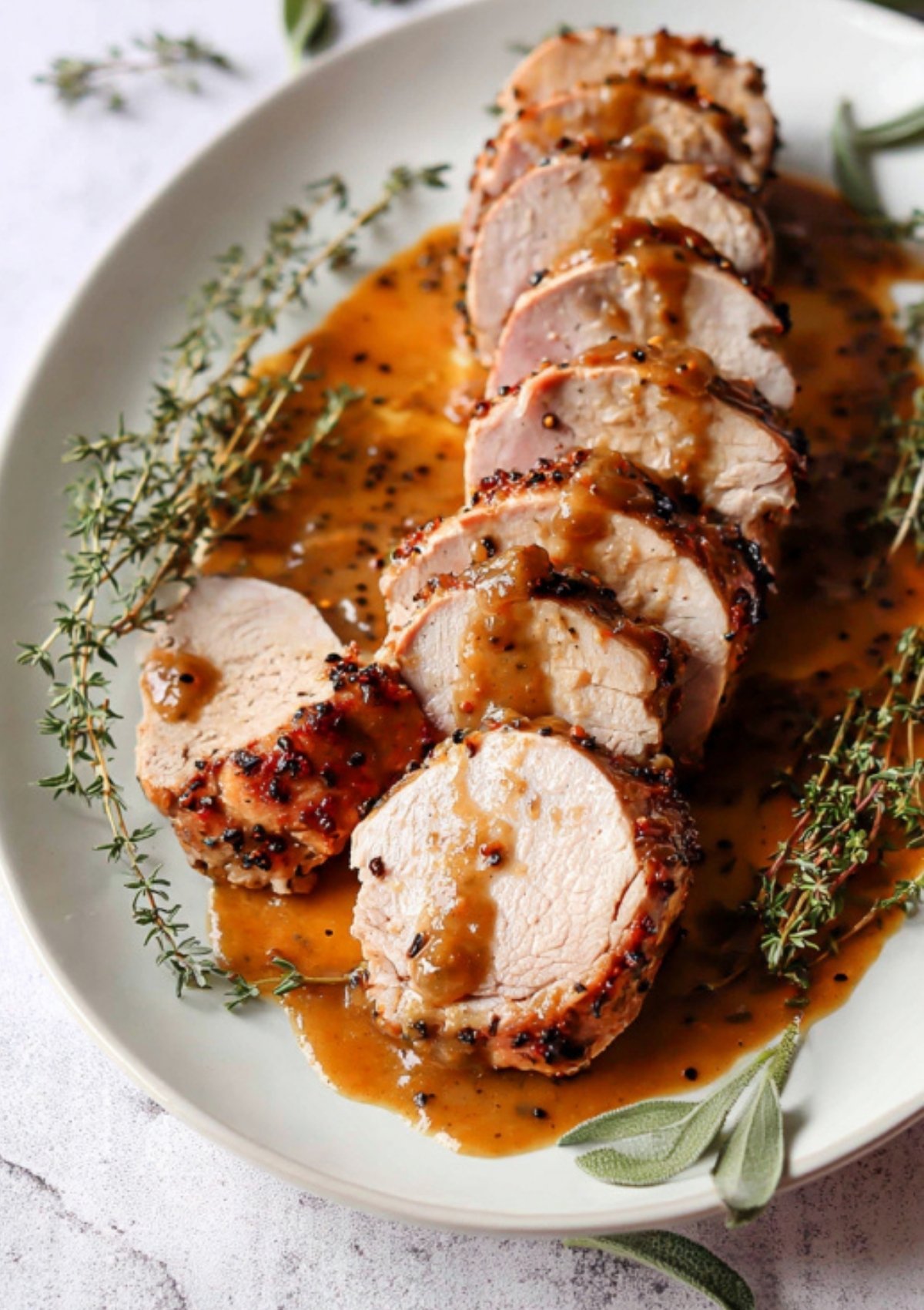 Seasoned pork tenderloin pieces browning inside the Instant Pot to form a golden crust before pressure cooking.