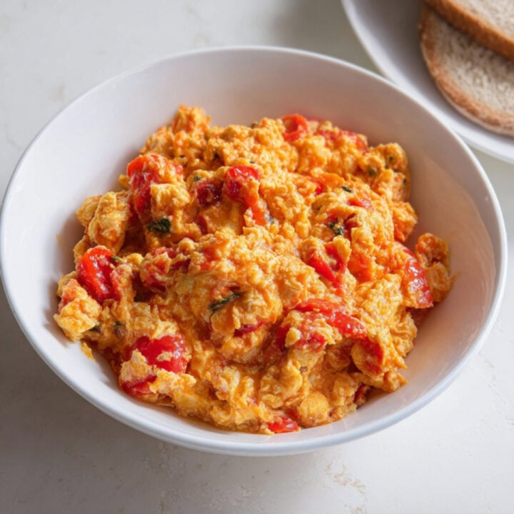 Overhead shot of a bowl filled with Nigerian-style egg sauce made with scrambled eggs, tomatoes, and peppers.