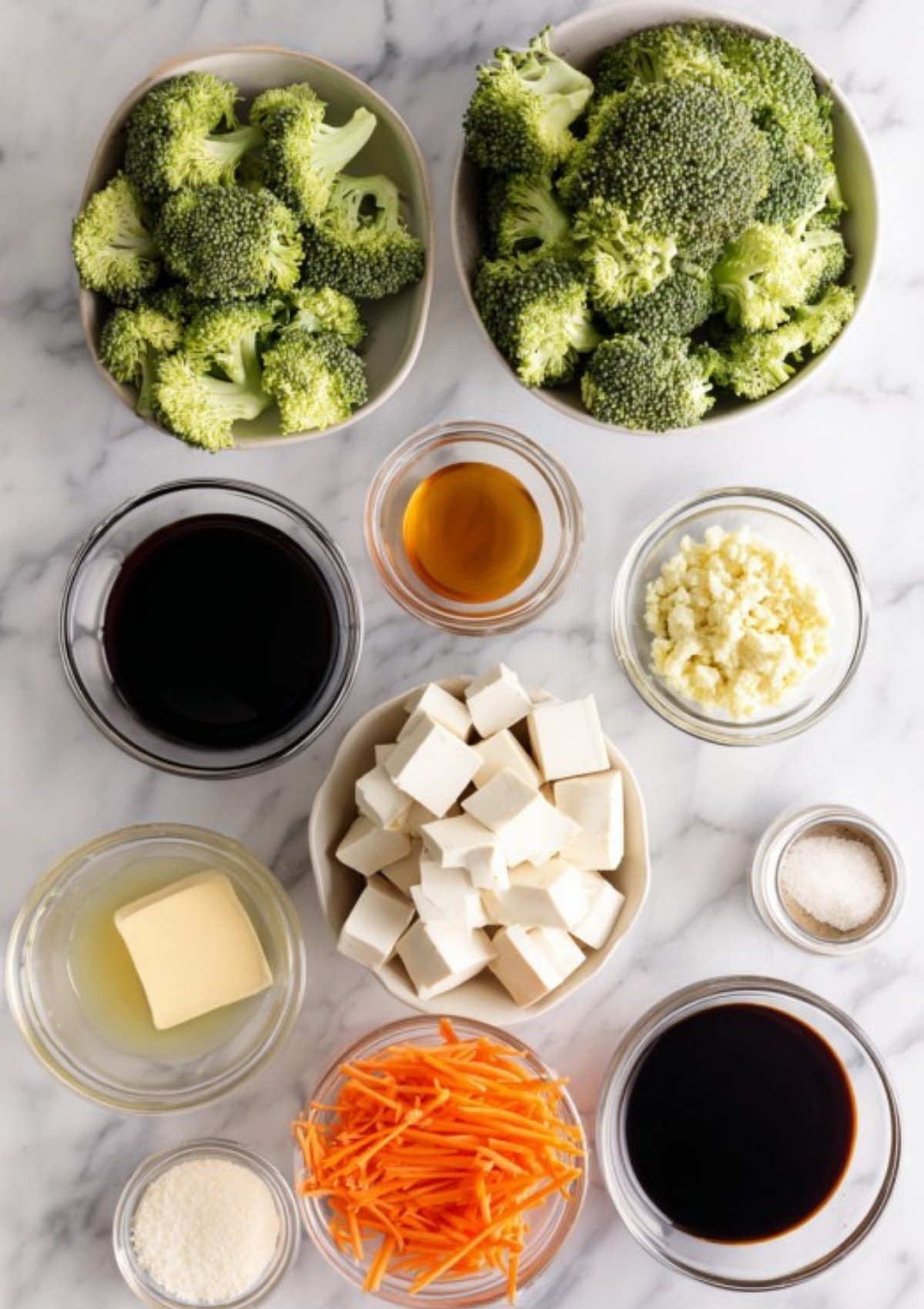 Overhead shot of broccoli, tofu, carrots, sauces, garlic, and seasonings prepped for a homemade veggie stir-fry—healthy, plant-based, and meal prep friendly.