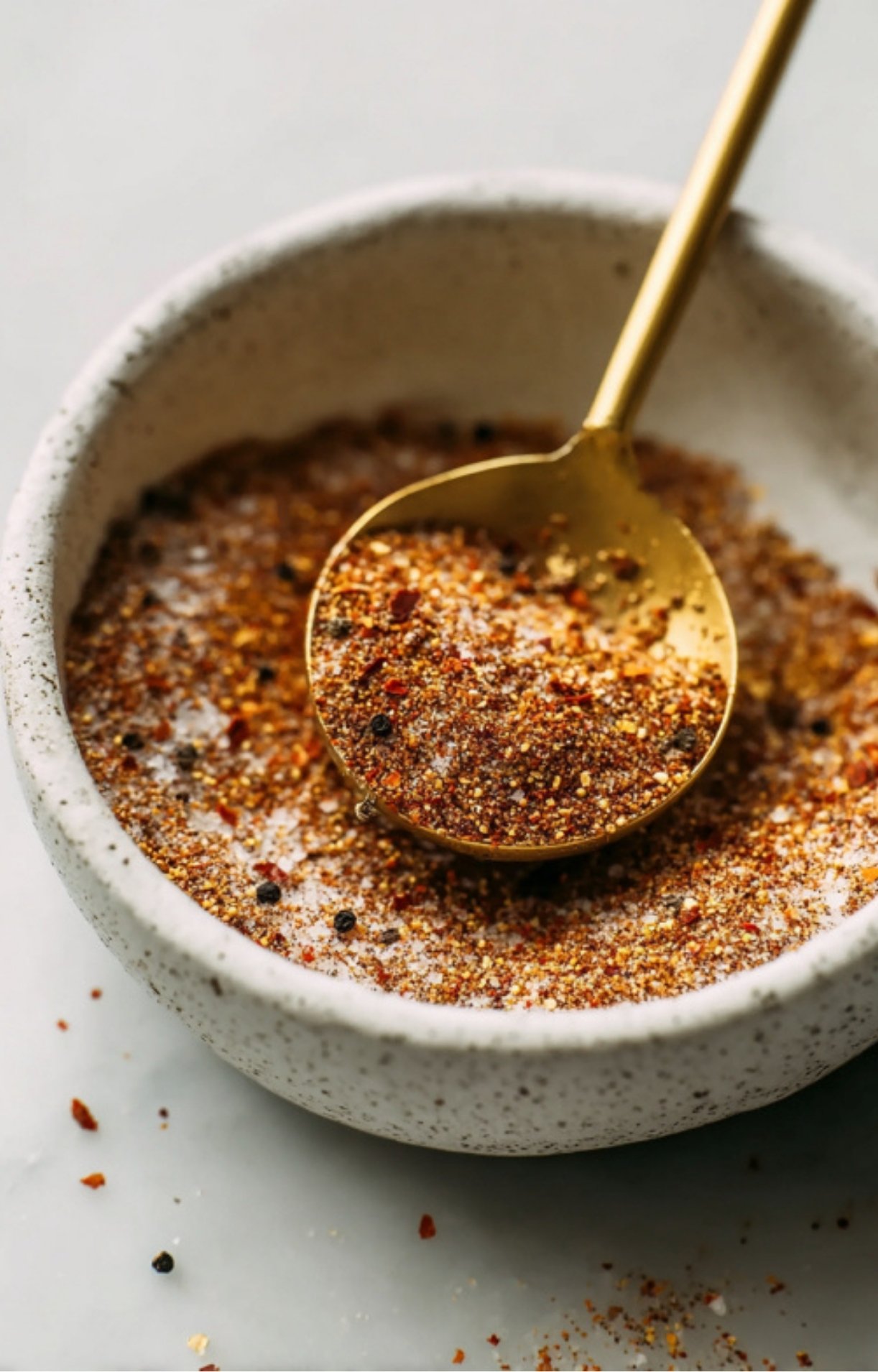 Closeup of a bowl filled with smoky barbecue spice rub, perfect for beef chuck roast and grilling