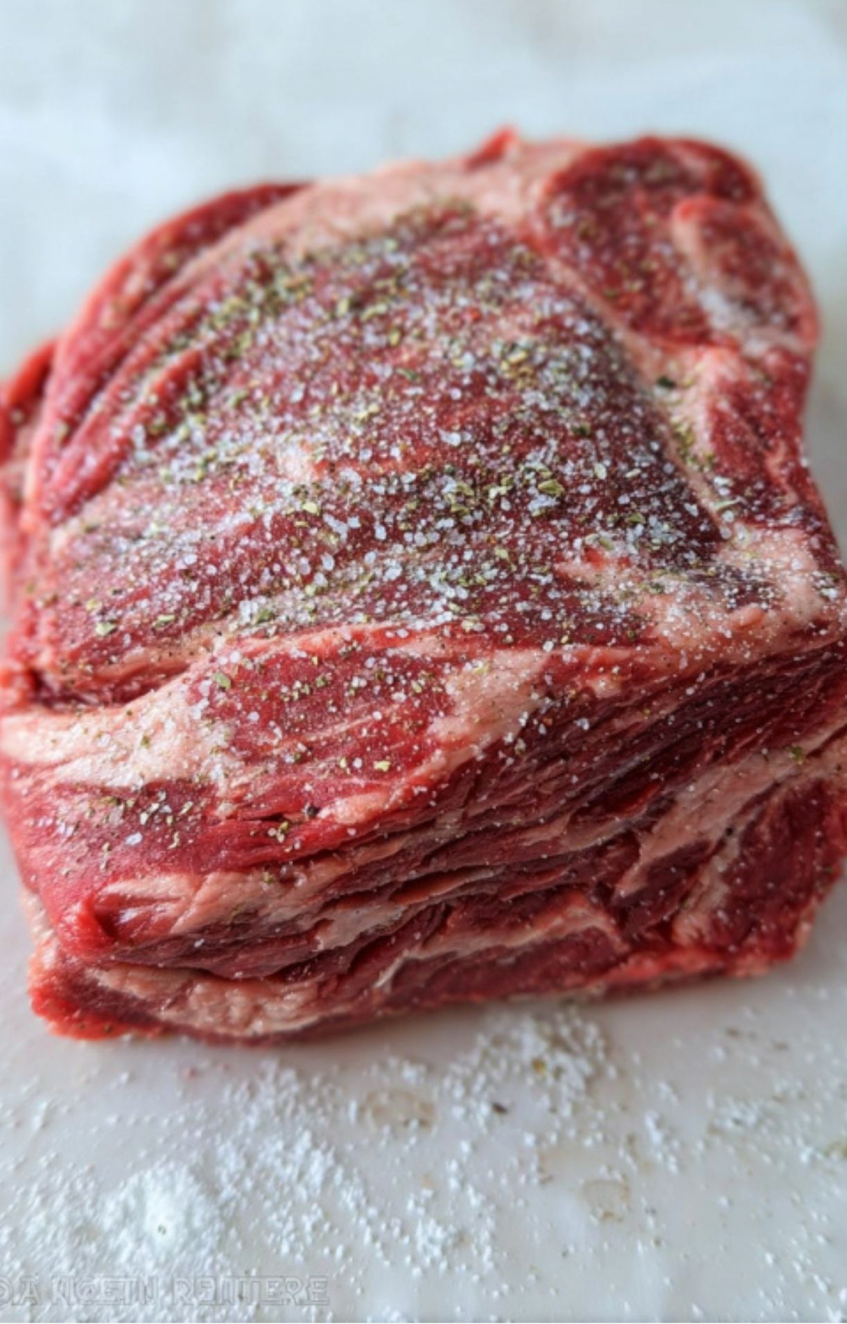 Raw beef chuck roast seasoned with salt and pepper, prepped for a savory, fork-tender Pot Roast in the Oven.
