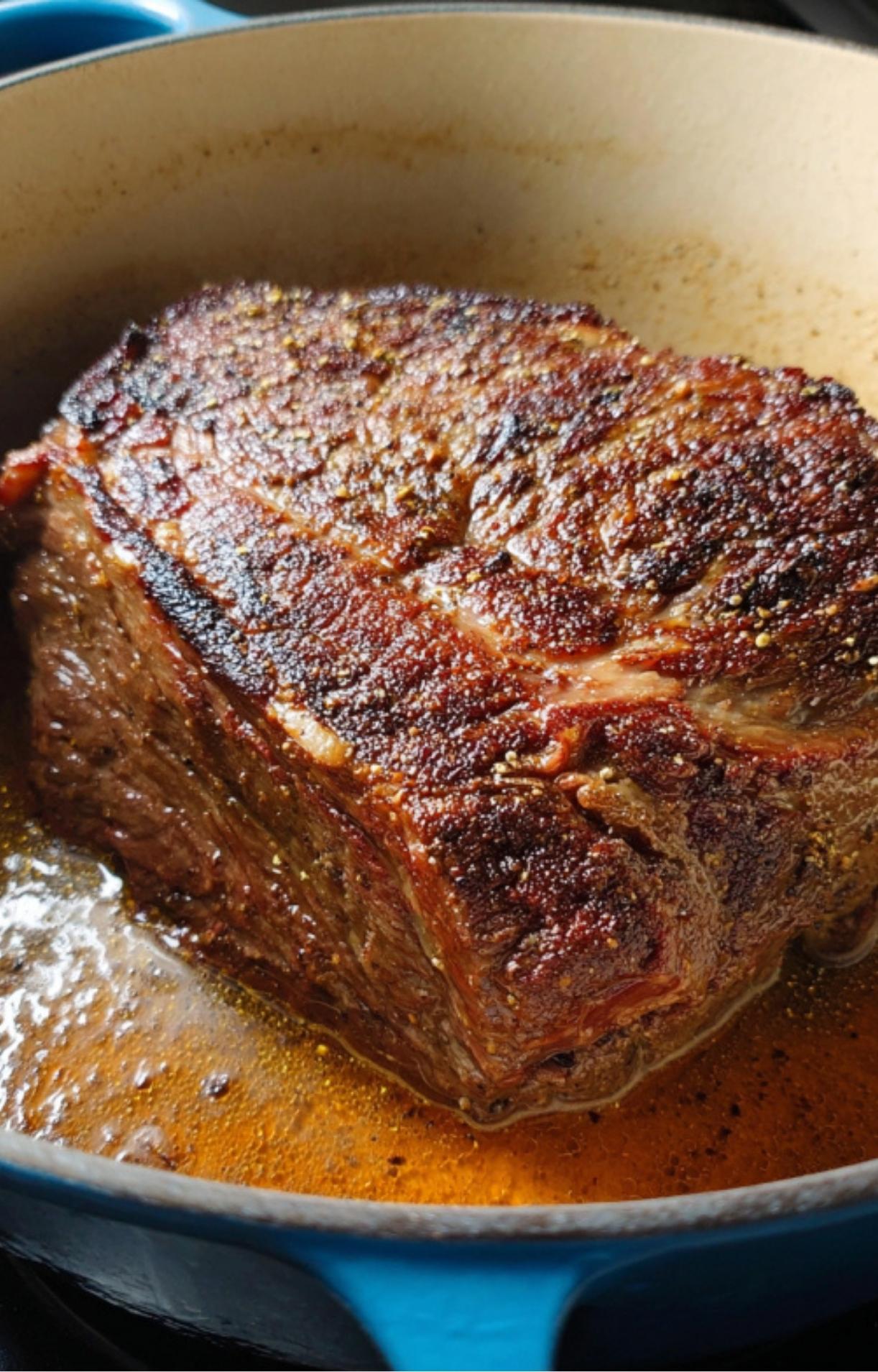 Chuck roast seared to a deep brown crust in a Dutch oven, locking in flavor for a juicy Pot Roast in the Oven.