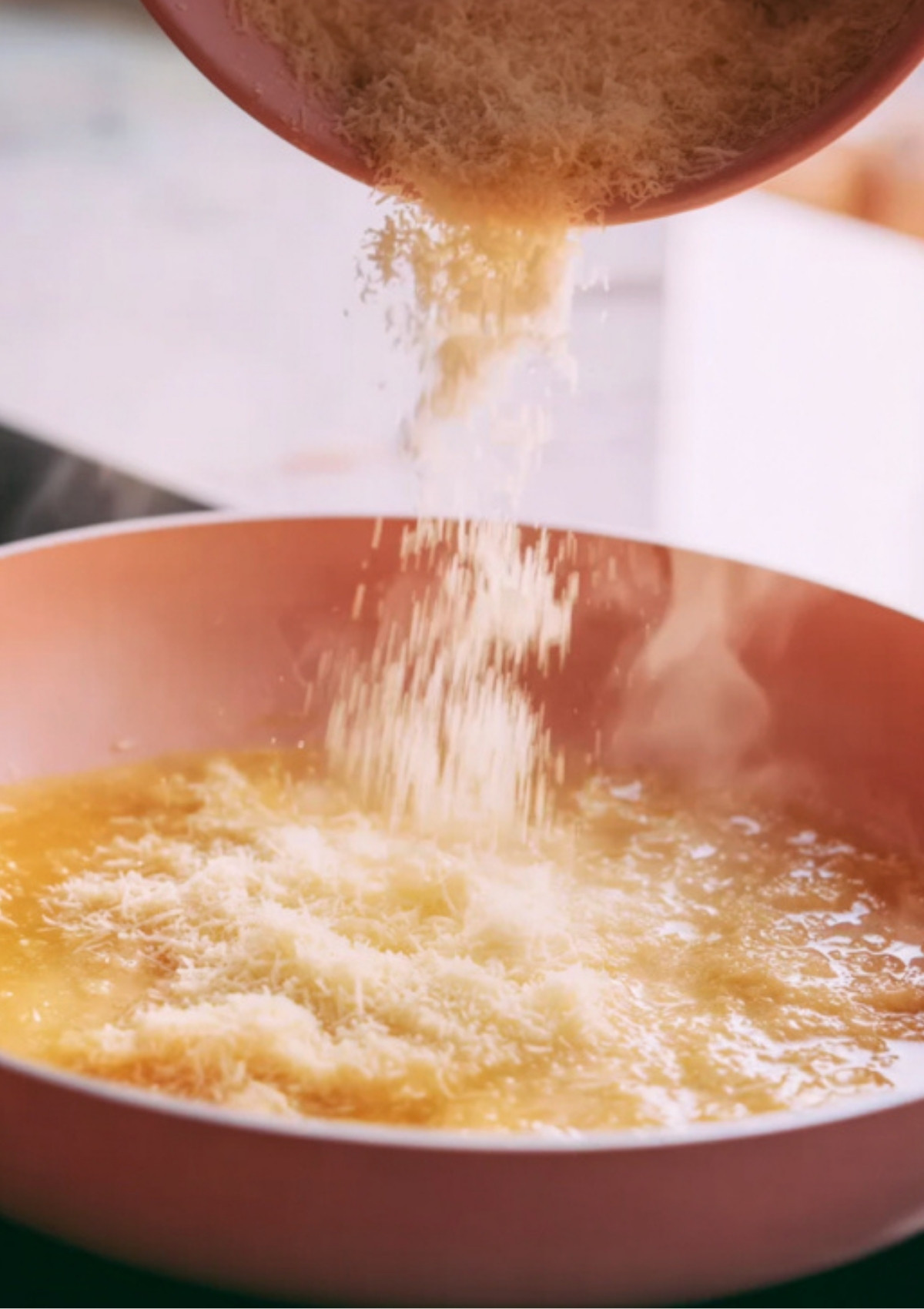 Fresh Parmesan melting into a creamy garlic butter sauce for shrimp pasta