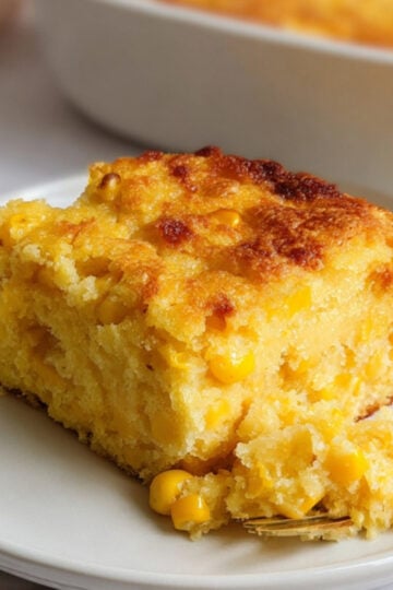 Golden, fluffy Southern corn pudding made from scratch, perfect for Thanksgiving, Christmas, or any potluck. Comfort food loaded with sweet corn and a crispy top.