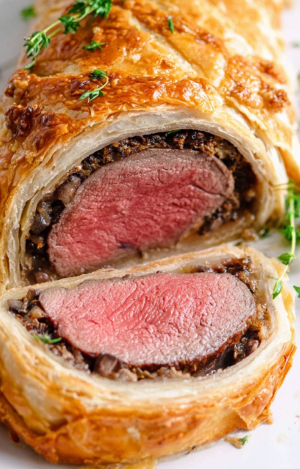 Close-up of beef wellington without mushrooms, wrapped in crisp puff pastry with savory onion filling, a stunning no mushroom recipe for festive celebrations