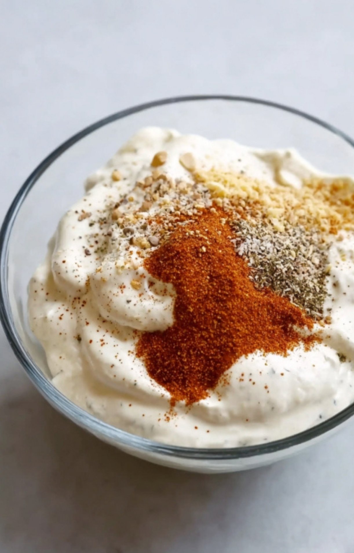 Smooth ranch and sour cream mixture, perfect for coating potatoes before baking.