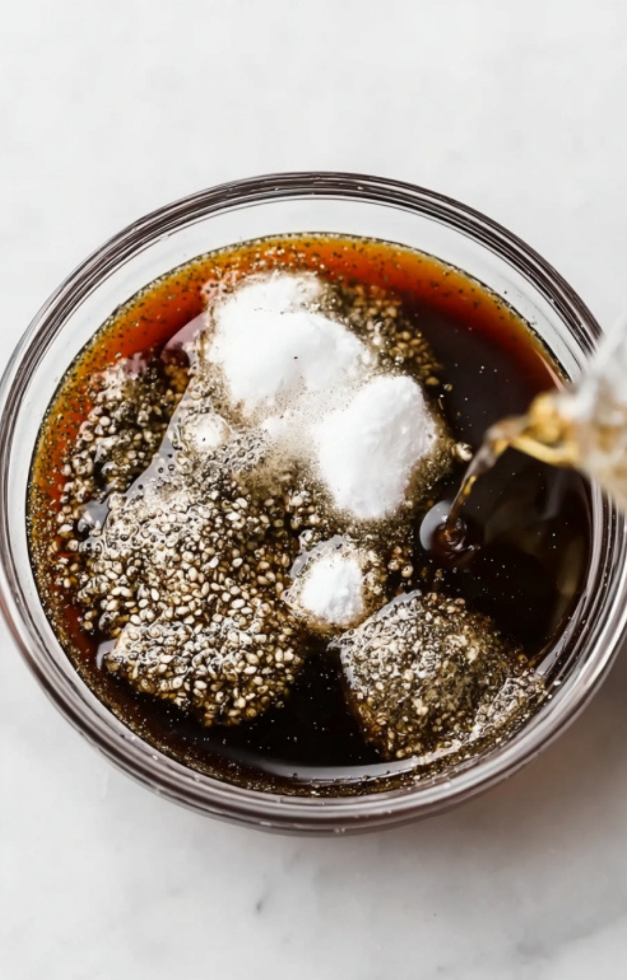 Combining seasonings and soy sauce for a homemade pepper steak marinade.