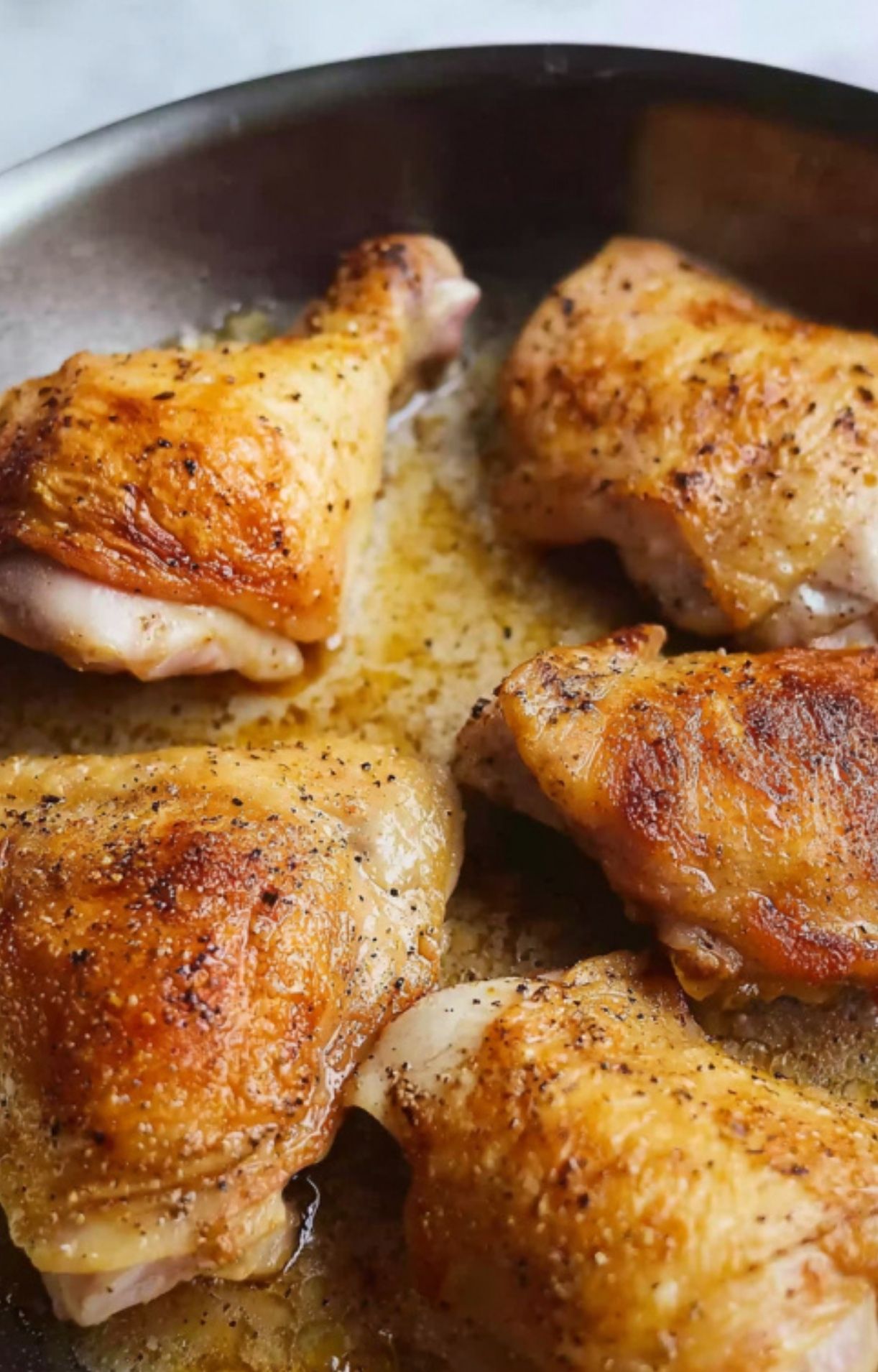 Browning chicken thighs and drumsticks in a skillet for the perfect golden crust.