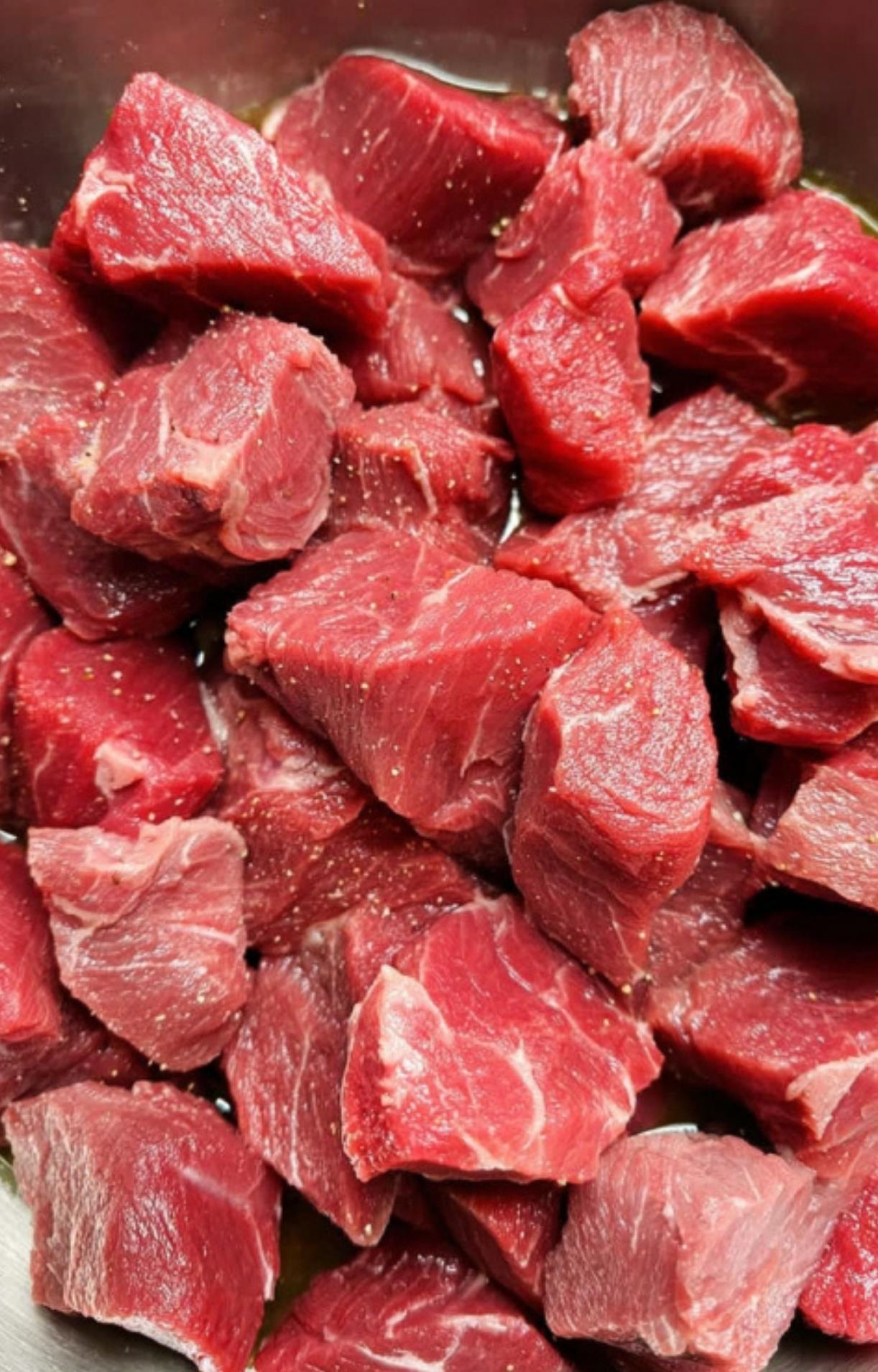 Chunks of raw stewing beef, perfect for slow-cooked German goulash recipes. Great for homemade comfort food, winter dinners, and classic beef stews.