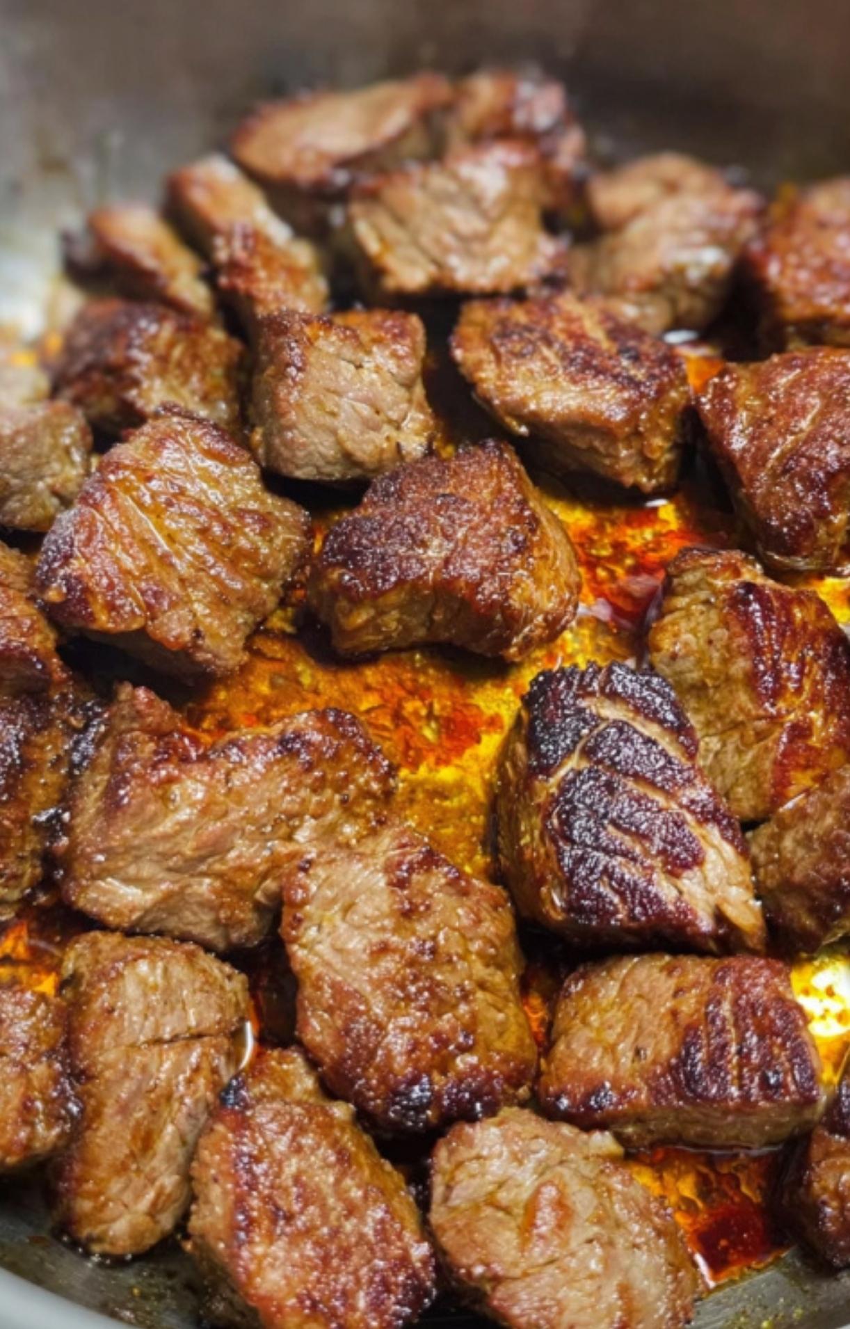 Cubes of beef seared to a golden brown in a pan, an essential step for making authentic Gulasch beef goulash. Perfect for rich, hearty stews and comfort food recipes.