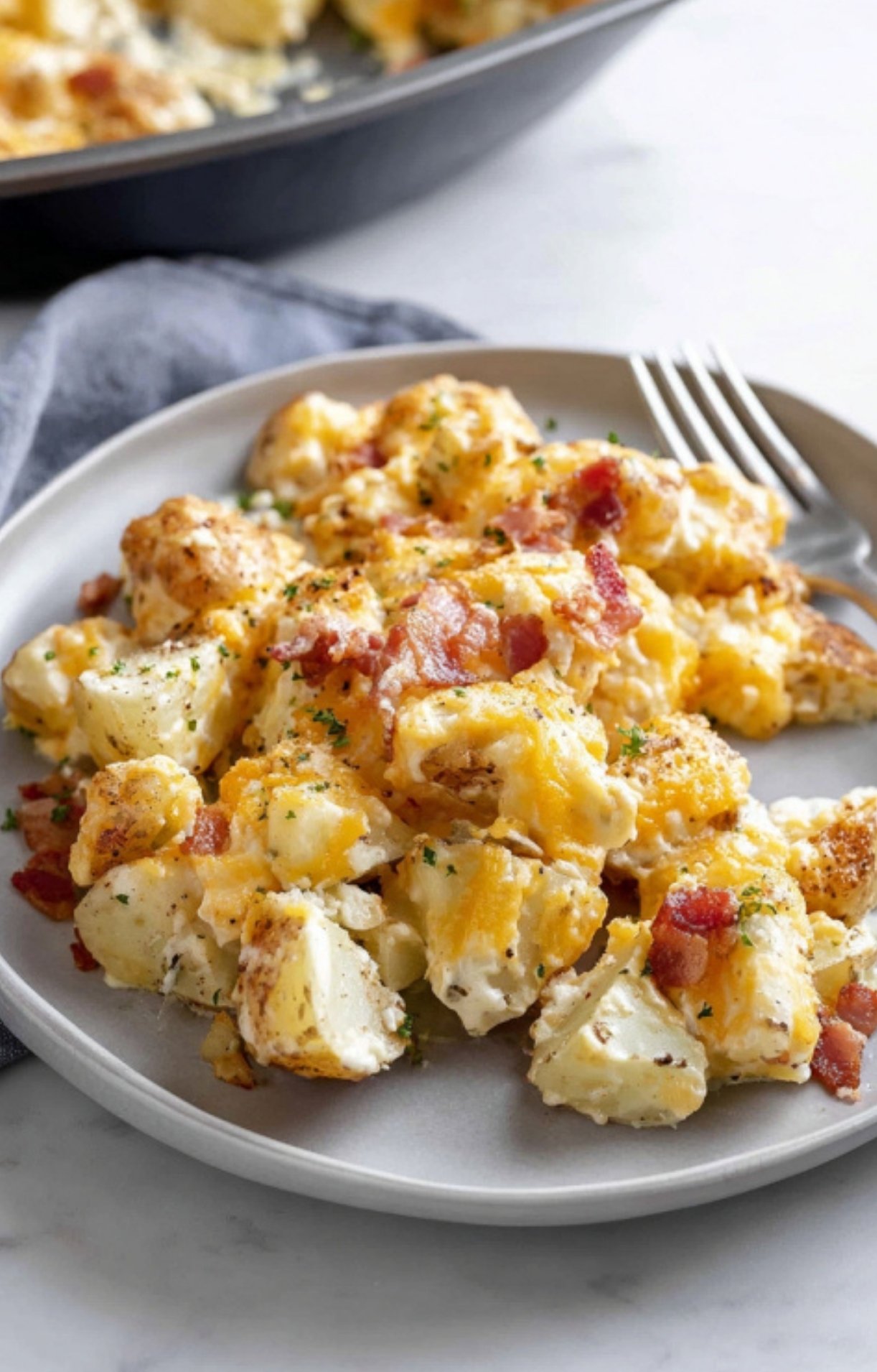 Golden potatoes topped with melted cheddar, ranch seasoning, and bacon. Simple, hearty side dish for any dinner table.