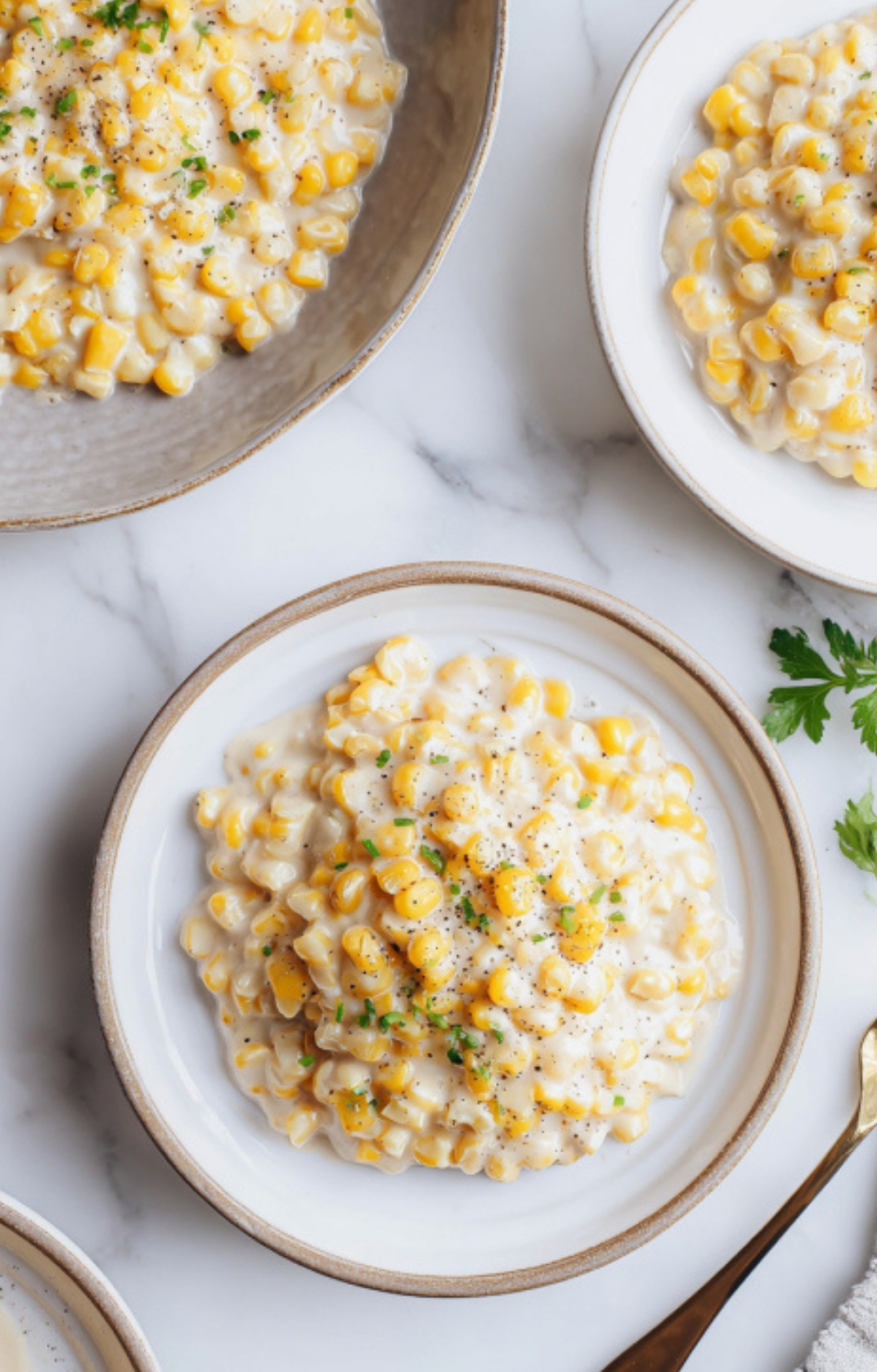 Bowls of homemade creamy canned corn, ready to serve for a holiday meal, potluck, or Sunday dinner. Rich, savory, and always a crowd favorite.