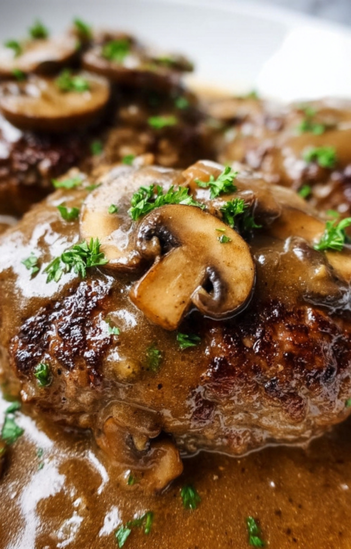 Golden-brown Salsberry Steak patties smothered in homemade mushroom gravy—an easy comfort food classic, ideal for cold weather meals, family dinners, and Sunday suppers.