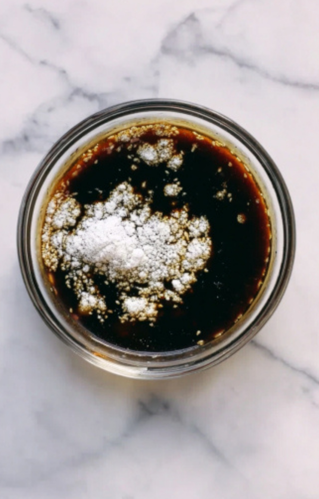 Glass bowl of homemade stir-fry sauce with soy sauce and cornstarch – easy recipe for healthy dinners