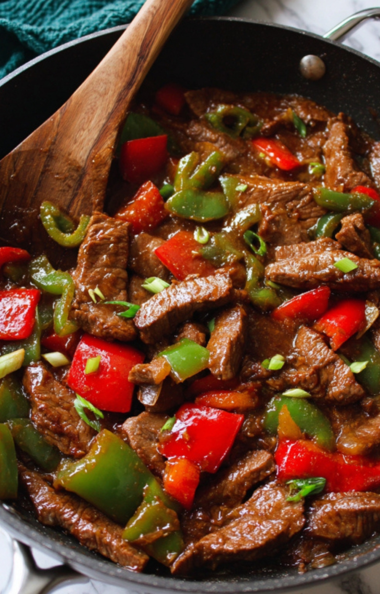 Tender beef and bell peppers simmered in a savory sauce for an easy skillet meal.