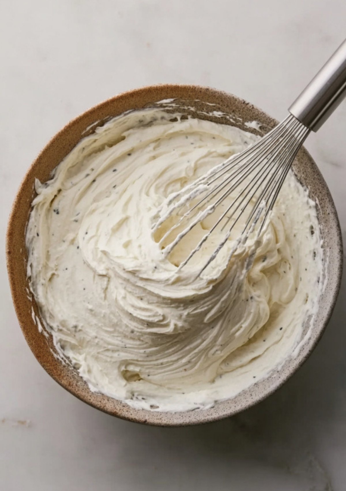 Creamy horseradish sauce whipped in a bowl, served as a dip for mini beef wellington appetizers and festive party platters.