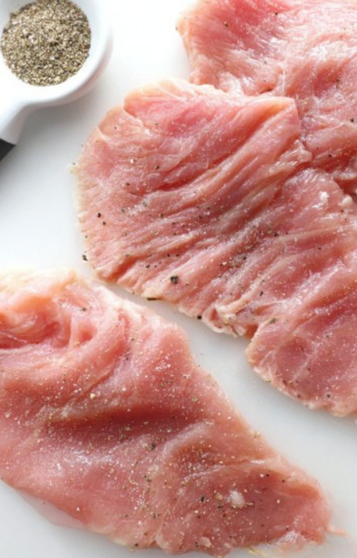 Capers and sauce bubbling in a pan. Tangy and bright sauce ready to top veal cutlets.