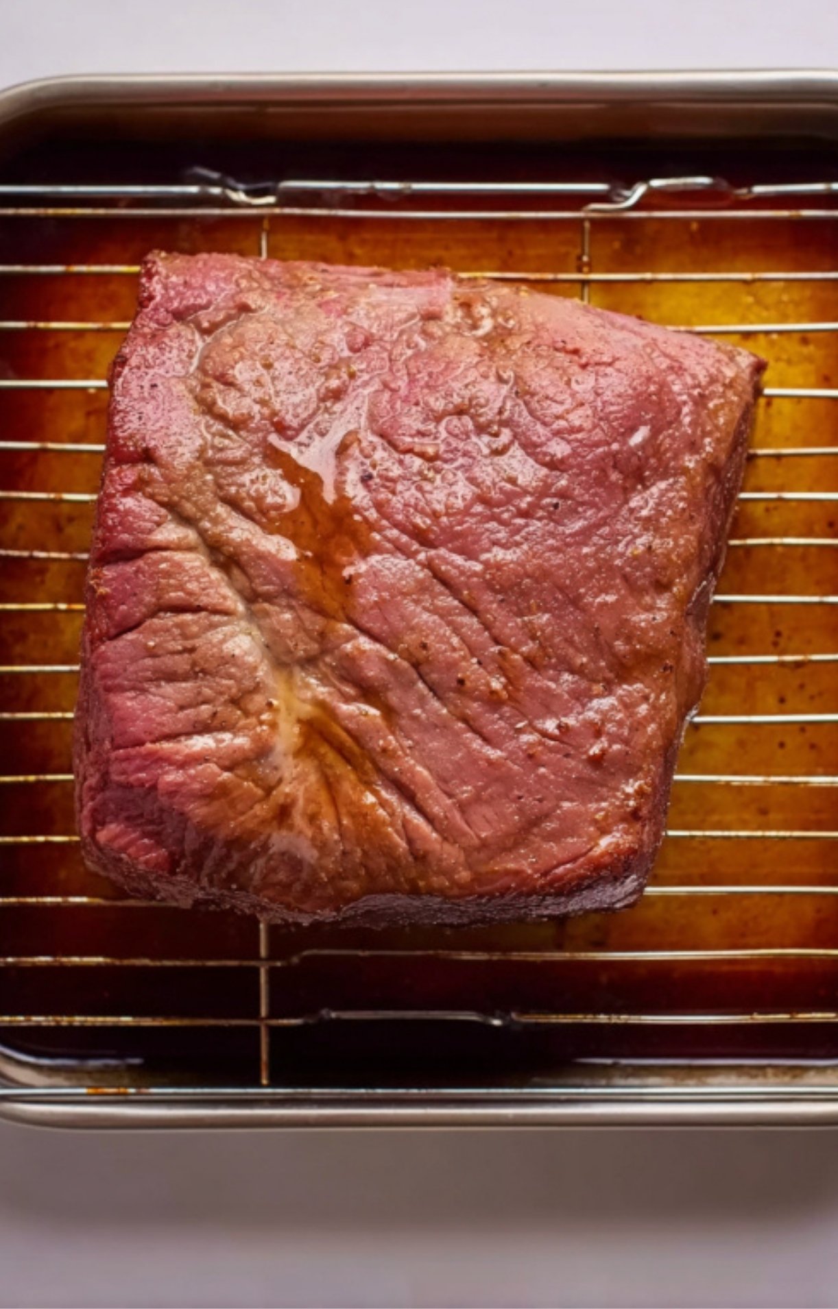 Whole brisket cooked in roasting pan with Guinness stout, rich brown crust and pan juices