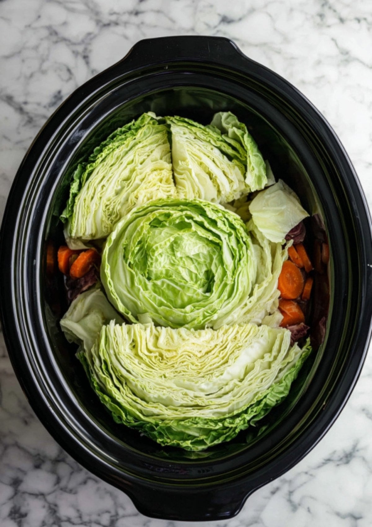 Fresh green cabbage wedges layered in a slow cooker, ready to cook with carrots and potatoes. Simple step for juicy corned beef and healthy vegetables, great for holiday recipes and meal prep.