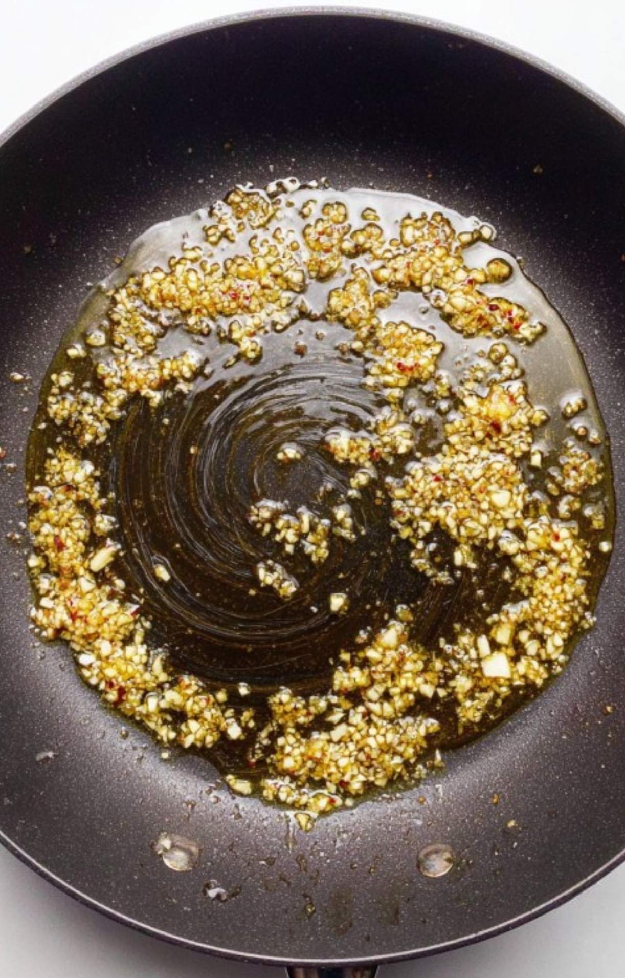 Raw veal cutlets sprinkled with salt and pepper on a white board. First step for making tender veal scallopini.