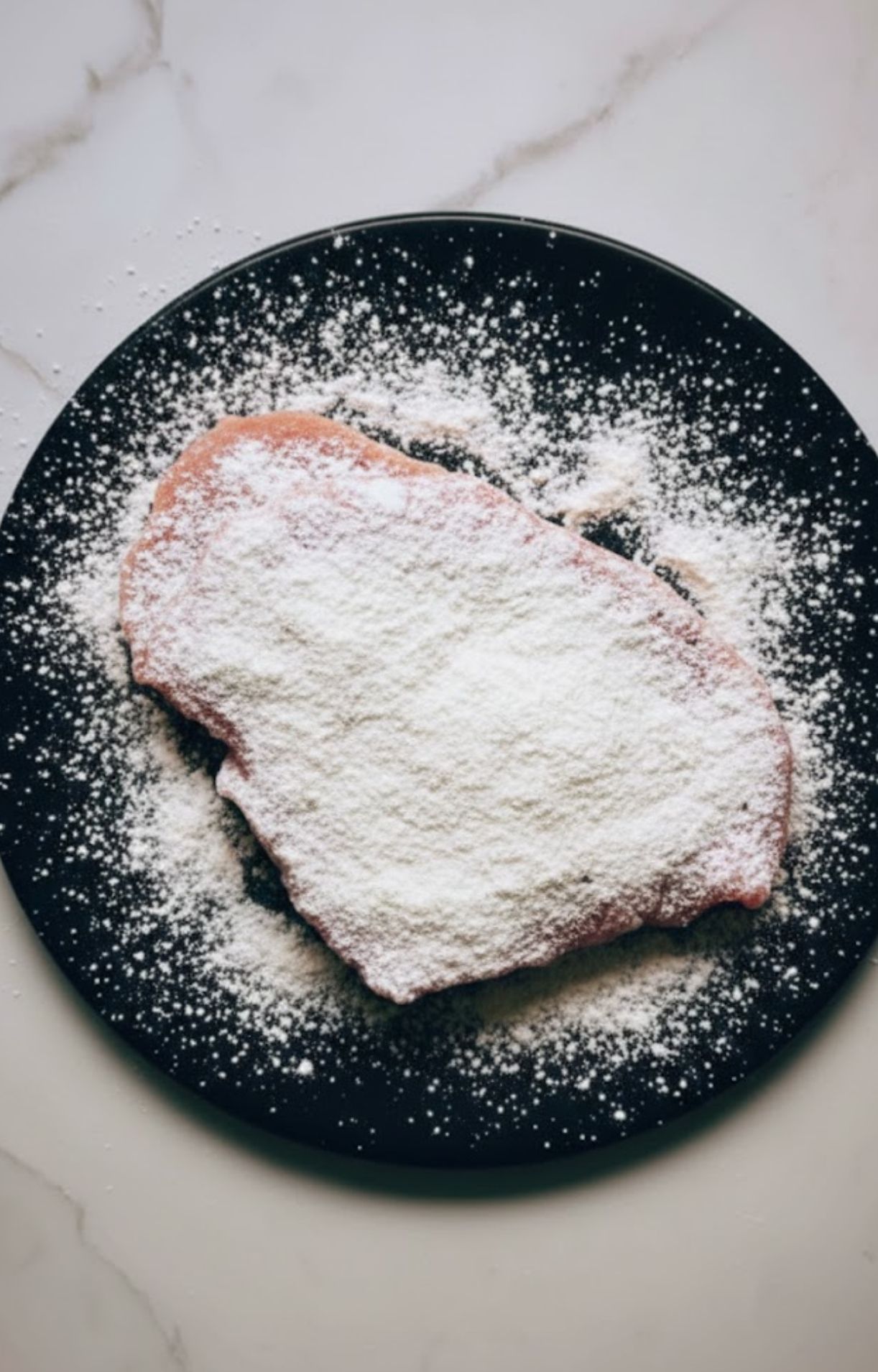 Capers simmering in white wine sauce inside a skillet, capturing the zesty, tangy flavors of authentic Italian veal piccata. Essential for easy skillet dinners.