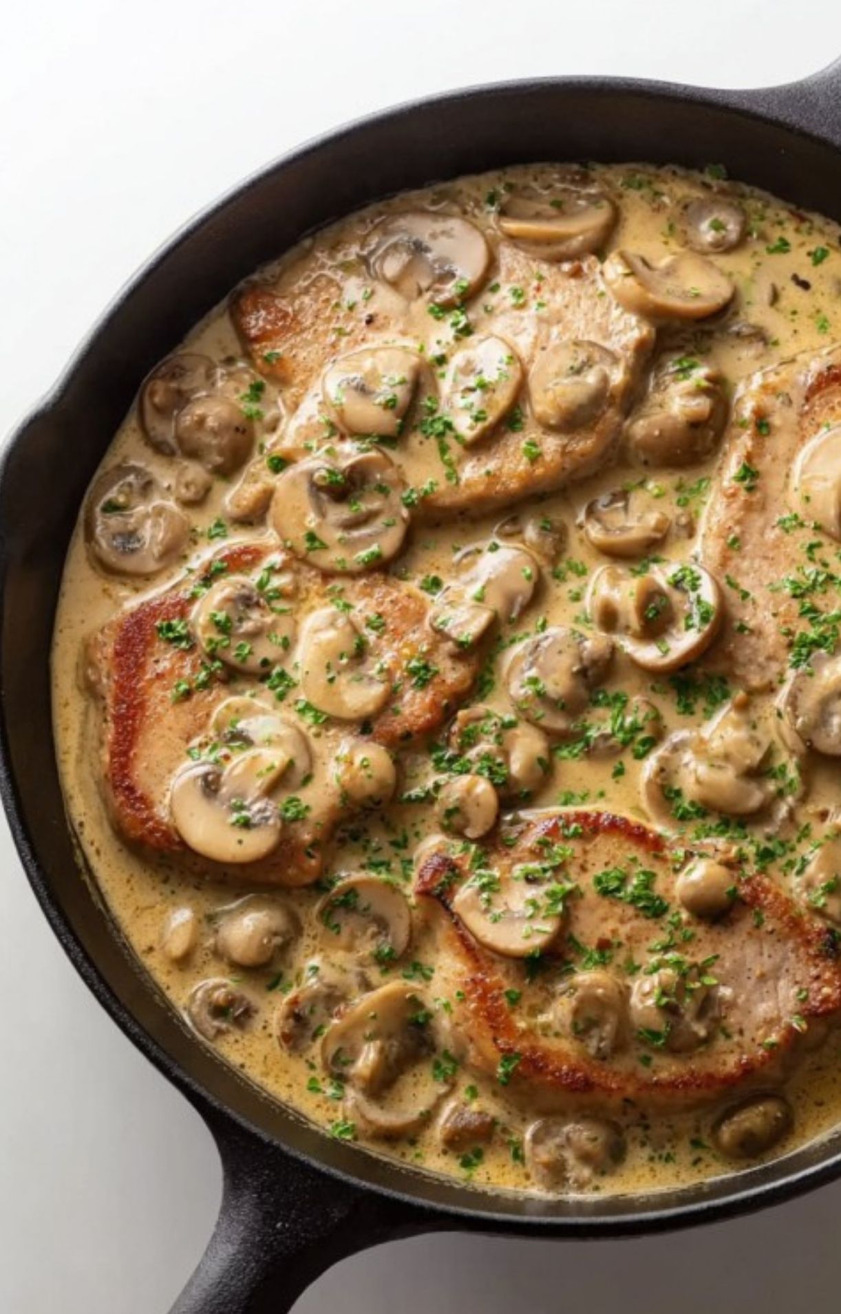 Tender veal scallopini in a creamy mushroom sauce, finished in a cast iron skillet. Restaurant-quality Italian dinner you can make at home.
