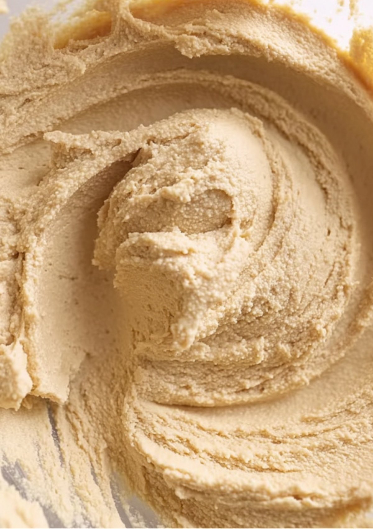 Freshly roasted butterflied leg of lamb resting on a wooden cutting board, showing a crispy herb crust