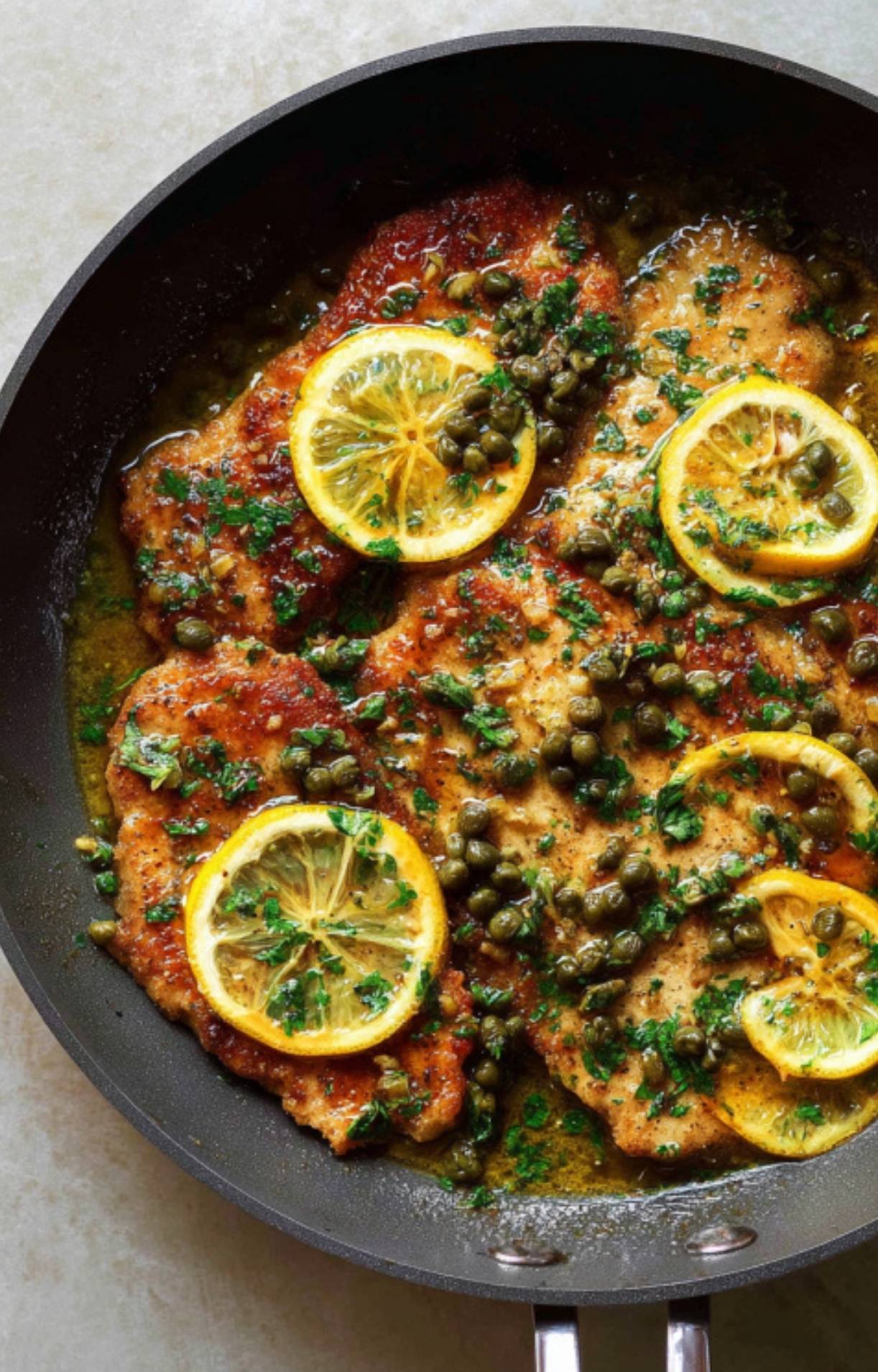 Collage of veal scallopini with golden crust, lemon slices, capers, and parsley. Bright, buttery, and easy Italian piccata recipe to impress.