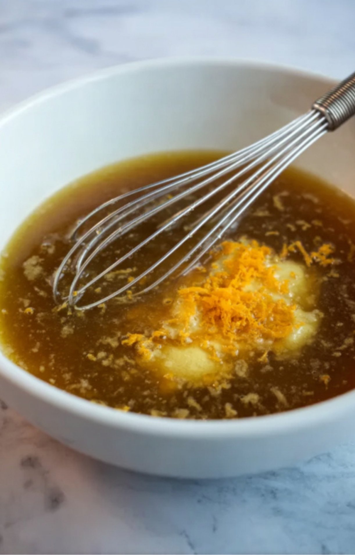 Homemade orange-brown sugar glaze for smoked pulled ham