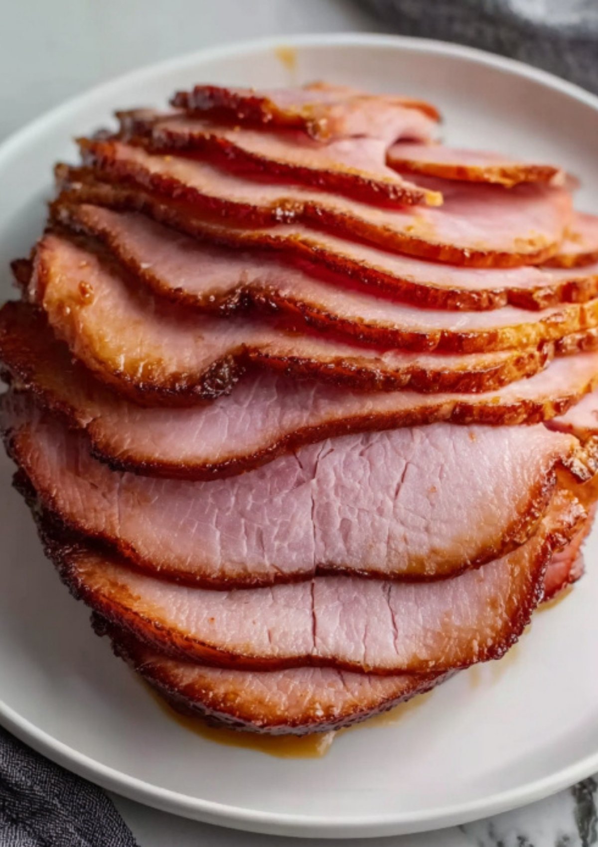 Tender slices of smoked ham ready for holiday serving platter