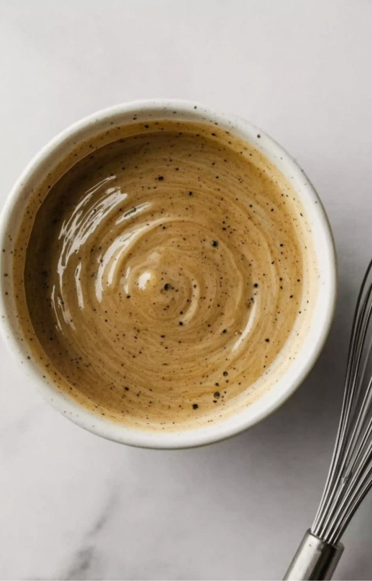 Bowl of creamy, spiced marinade ready for steak. Adds flavor and tenderness for the best grilled steak.