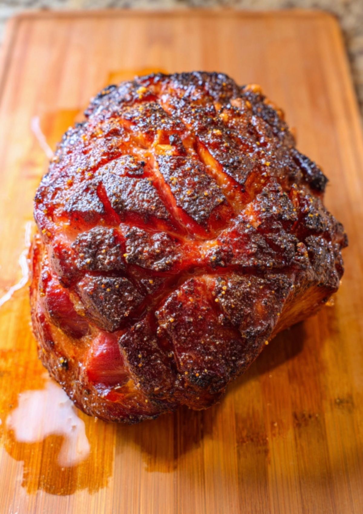 Twice smoked ham resting before slicing, rich in smoky flavor