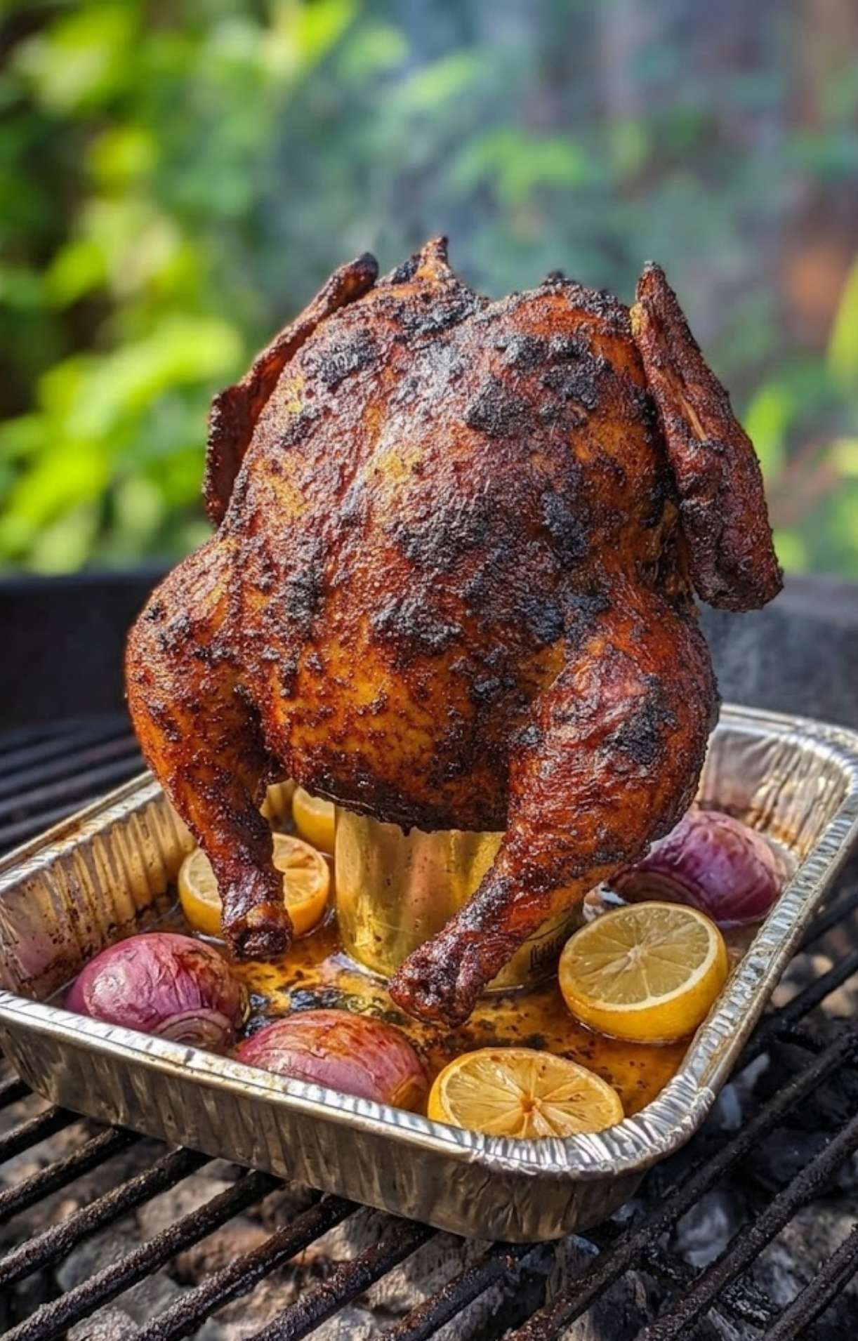 The finished golden-brown chicken standing on a beer can, showing a dark, caramelized skin and smoky texture from the charcoal.