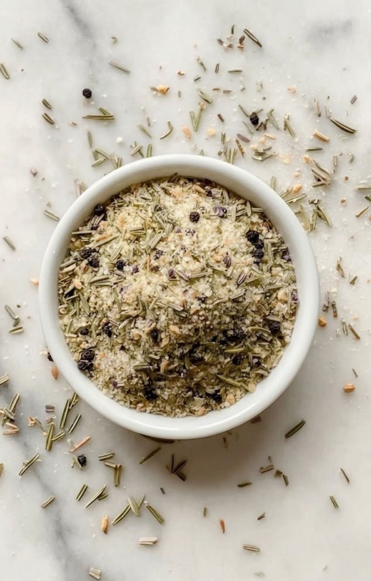 A white bowl overflowing with a well-blended Smoked Tomahawk Steak Rub, showcasing a coarse texture perfect for crusting meat.