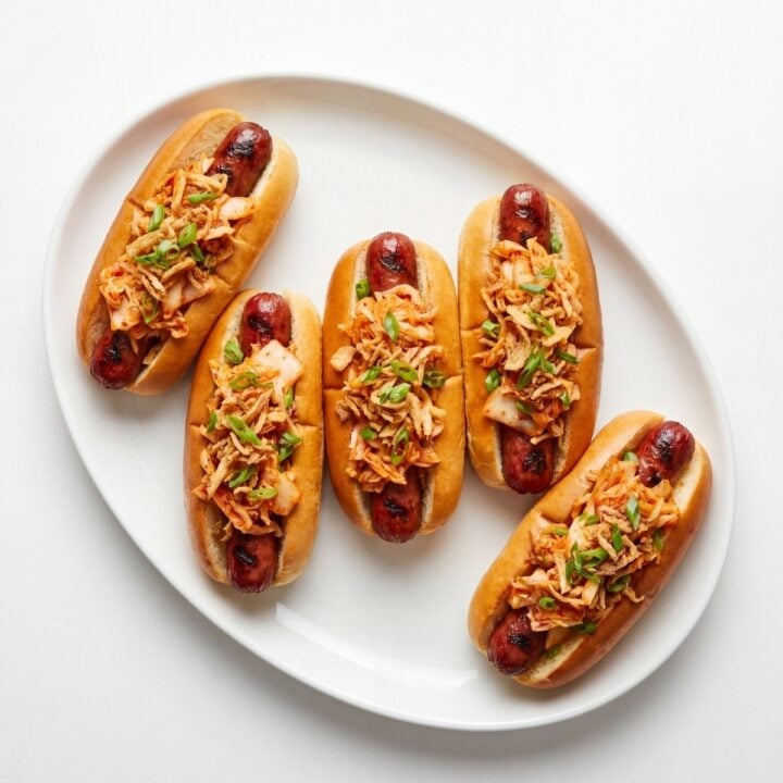 wagyu beef hot dogs served on plate with kimchi slaw topping perfect BBQ party food idea