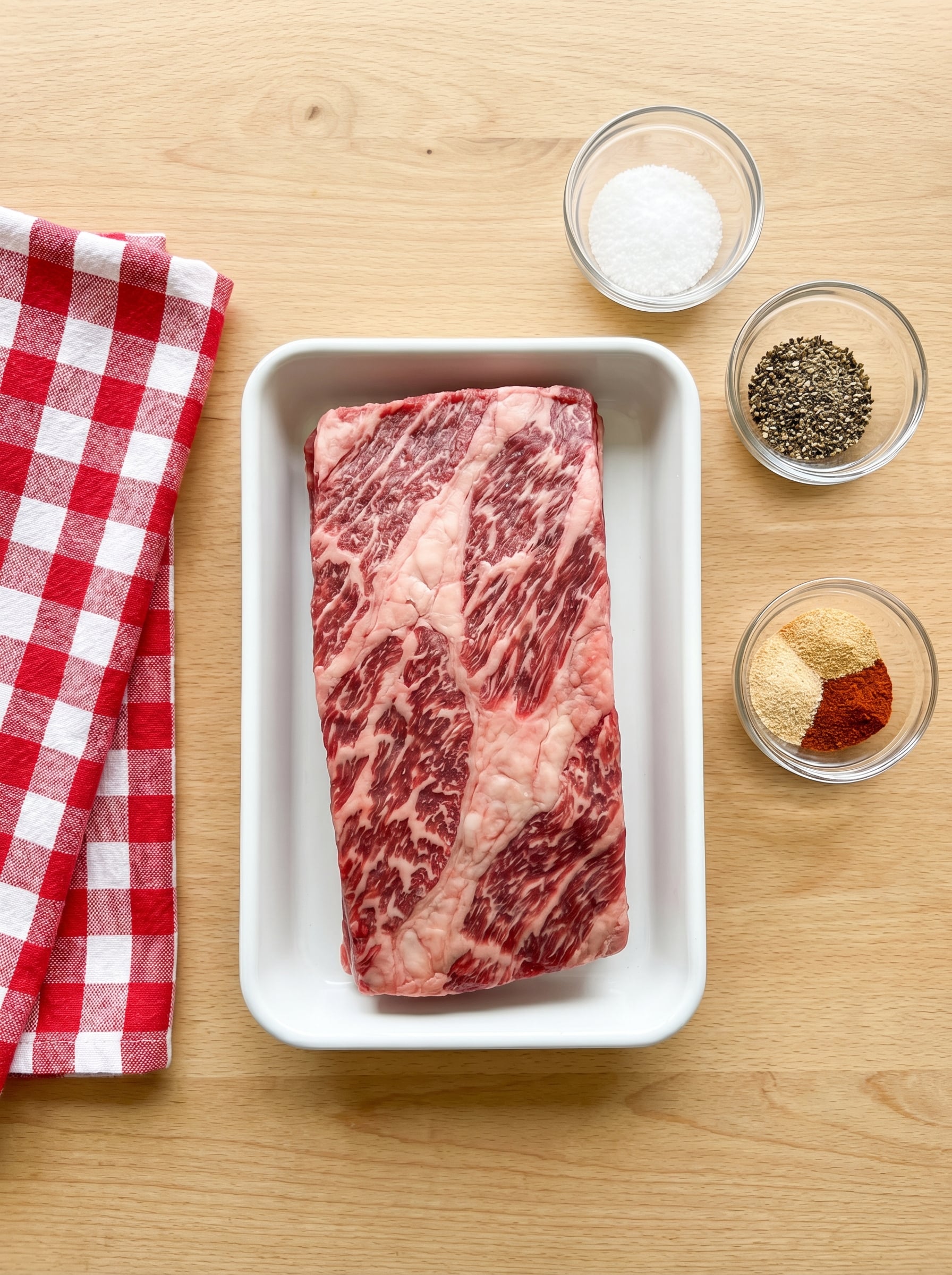 Raw beef short ribs with spices ready for pellet smoker recipe preparation