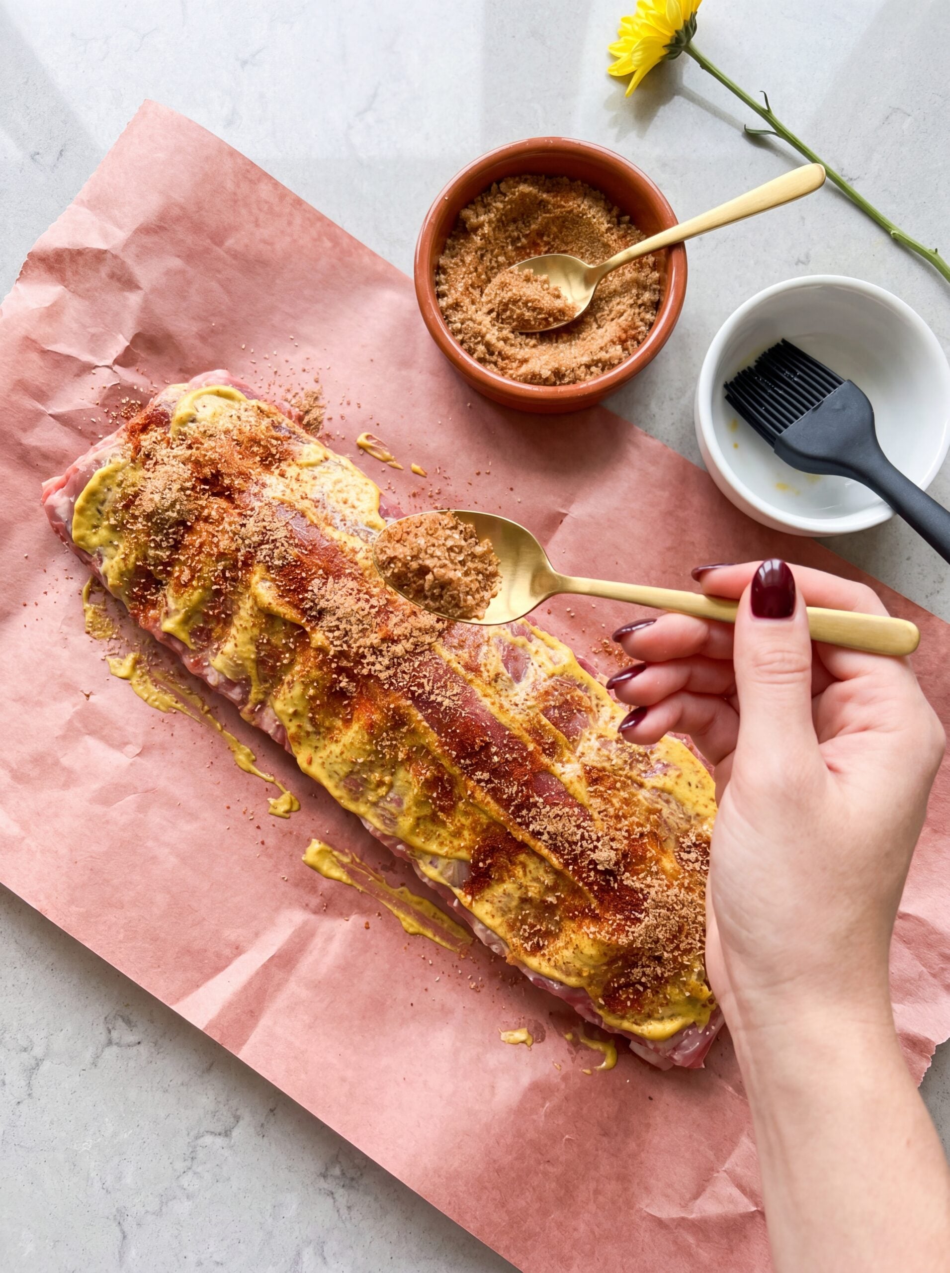 adding dry rub to ribs for 3 2 1 pellet smoker ribs recipe seasoning step