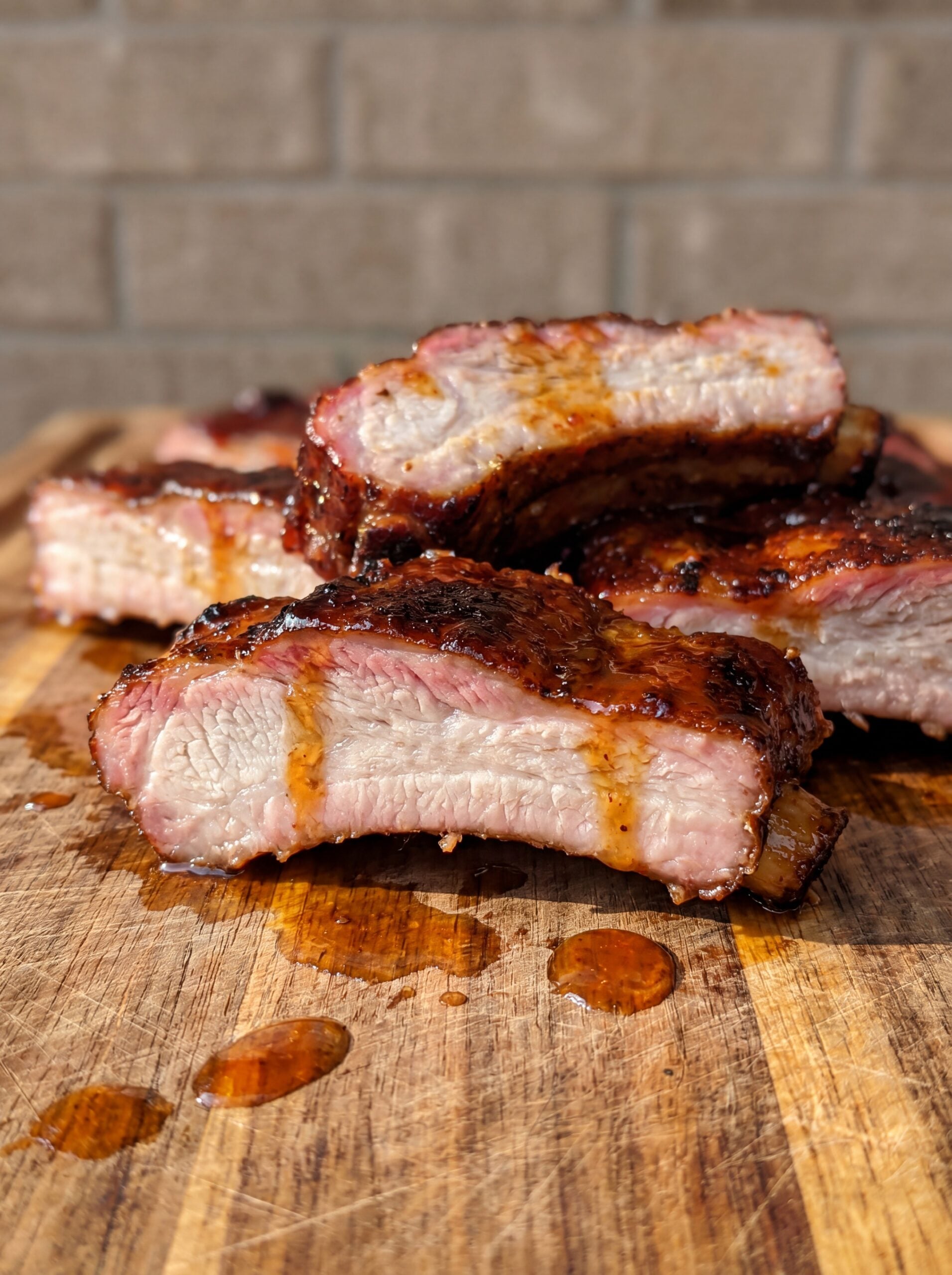 sliced country style ribs showing juicy inside texture from pellet smoker
