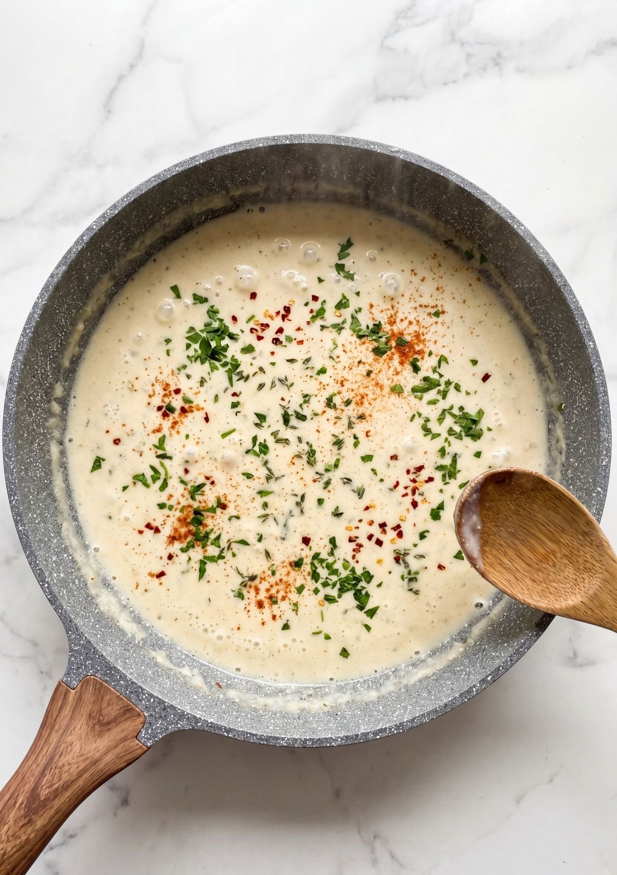 creamy cowboy butter sauce simmering with herbs and spices for spaghetti recipe