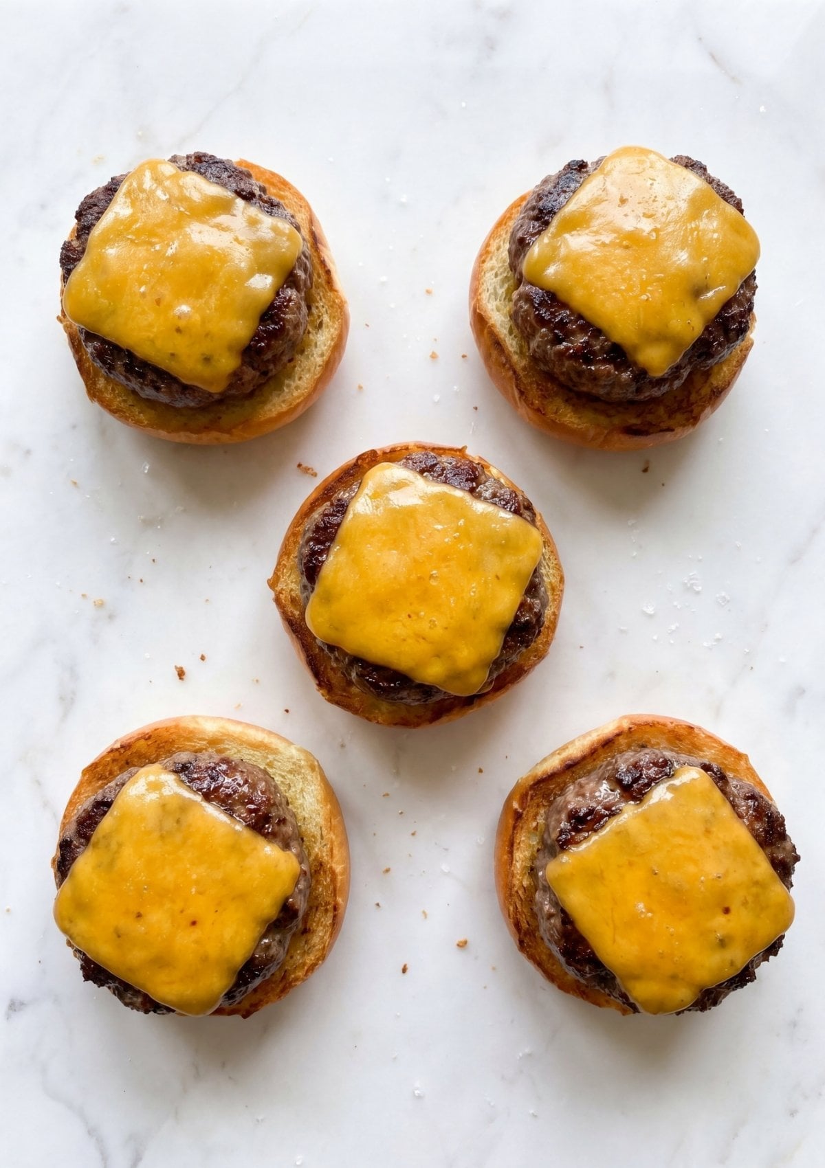 open face wagyu beef sliders with melted cheddar cheese on toasted buns easy mini burgers
