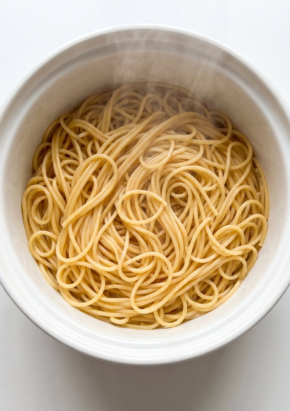 freshly cooked spaghetti noodles ready for cowboy butter sauce easy pasta base