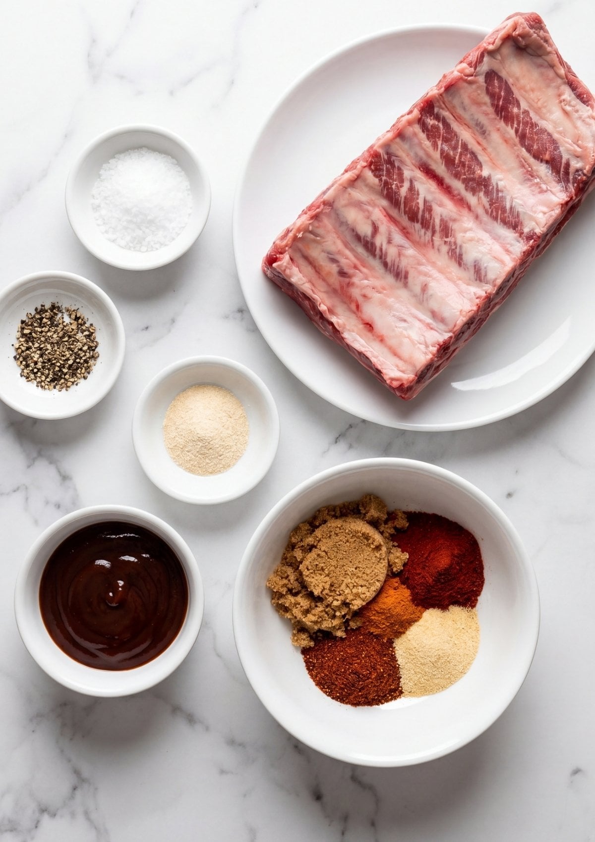 beef ribs pellet smoker recipe ingredients with raw beef ribs salt pepper garlic powder brown sugar paprika and BBQ sauce ready for smoking