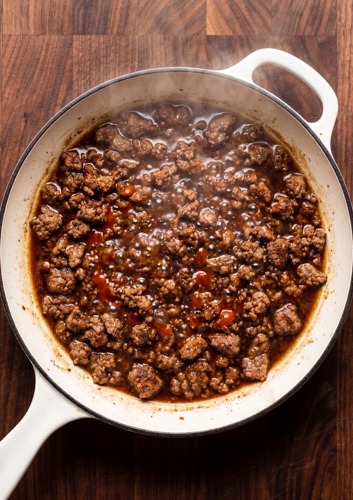 seasoned ground beef simmering in sauce for one pot cowboy spaghetti recipe