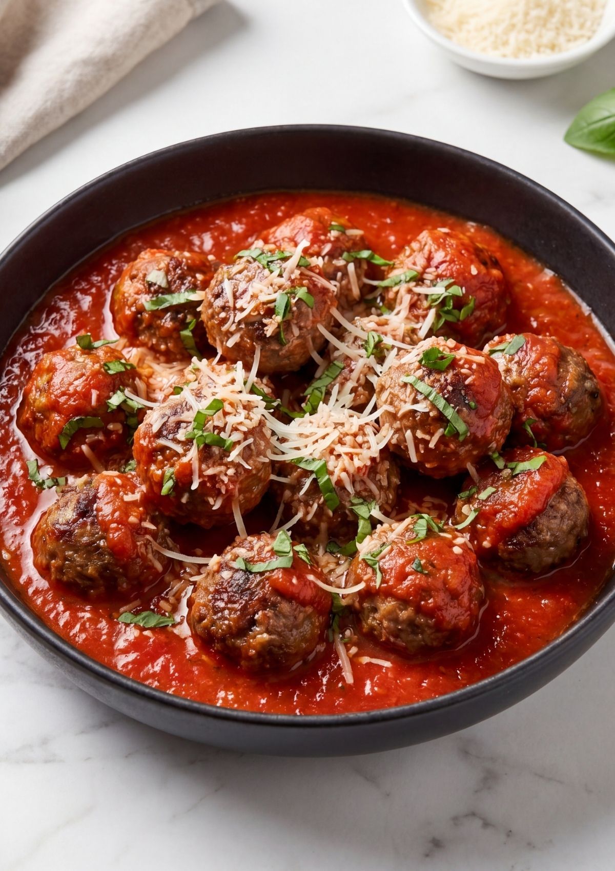 wagyu beef meatballs served in tomato sauce topped with parmesan and fresh basil easy meal