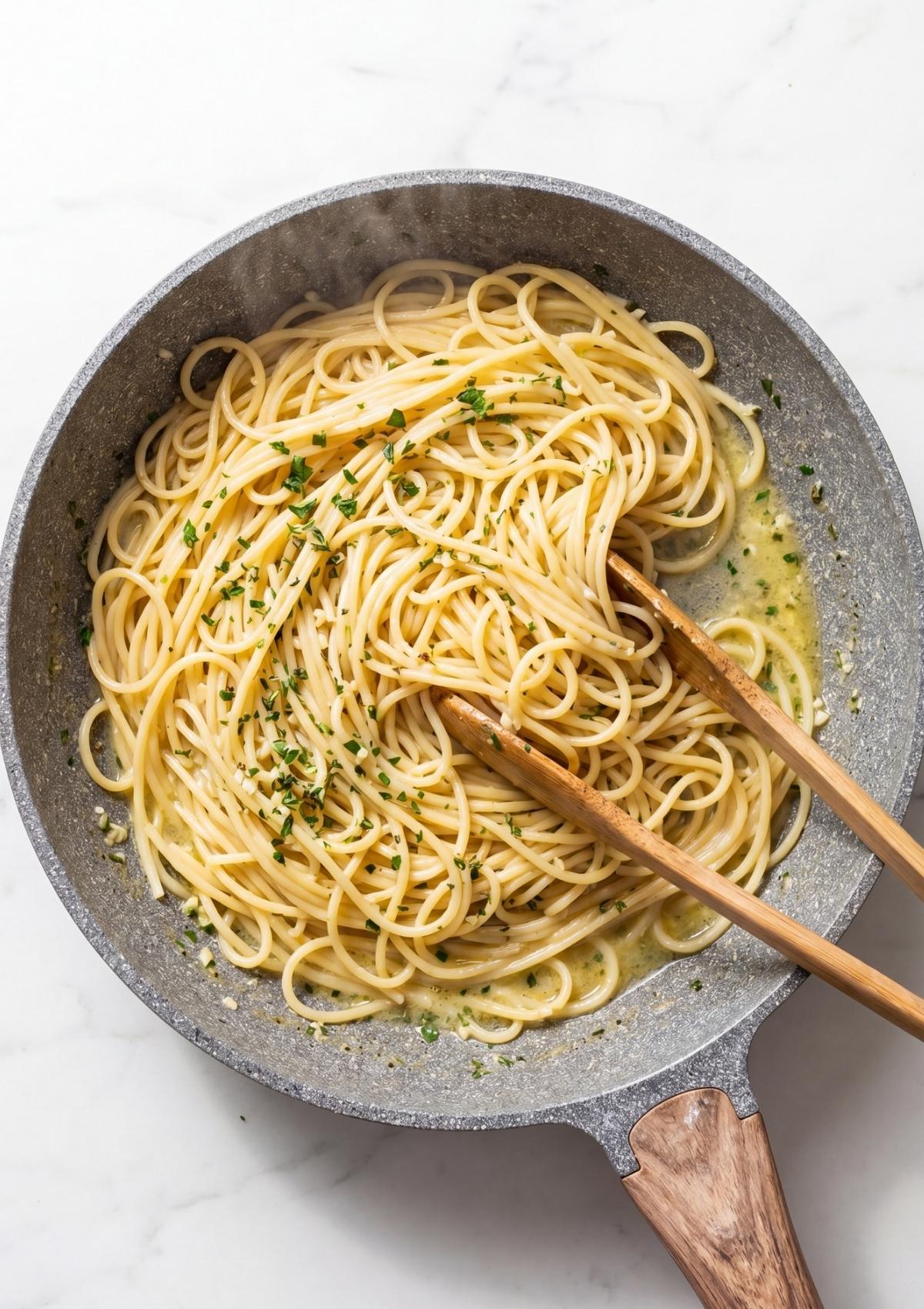 spaghetti tossed in creamy cowboy butter sauce in skillet quick easy pasta recipe