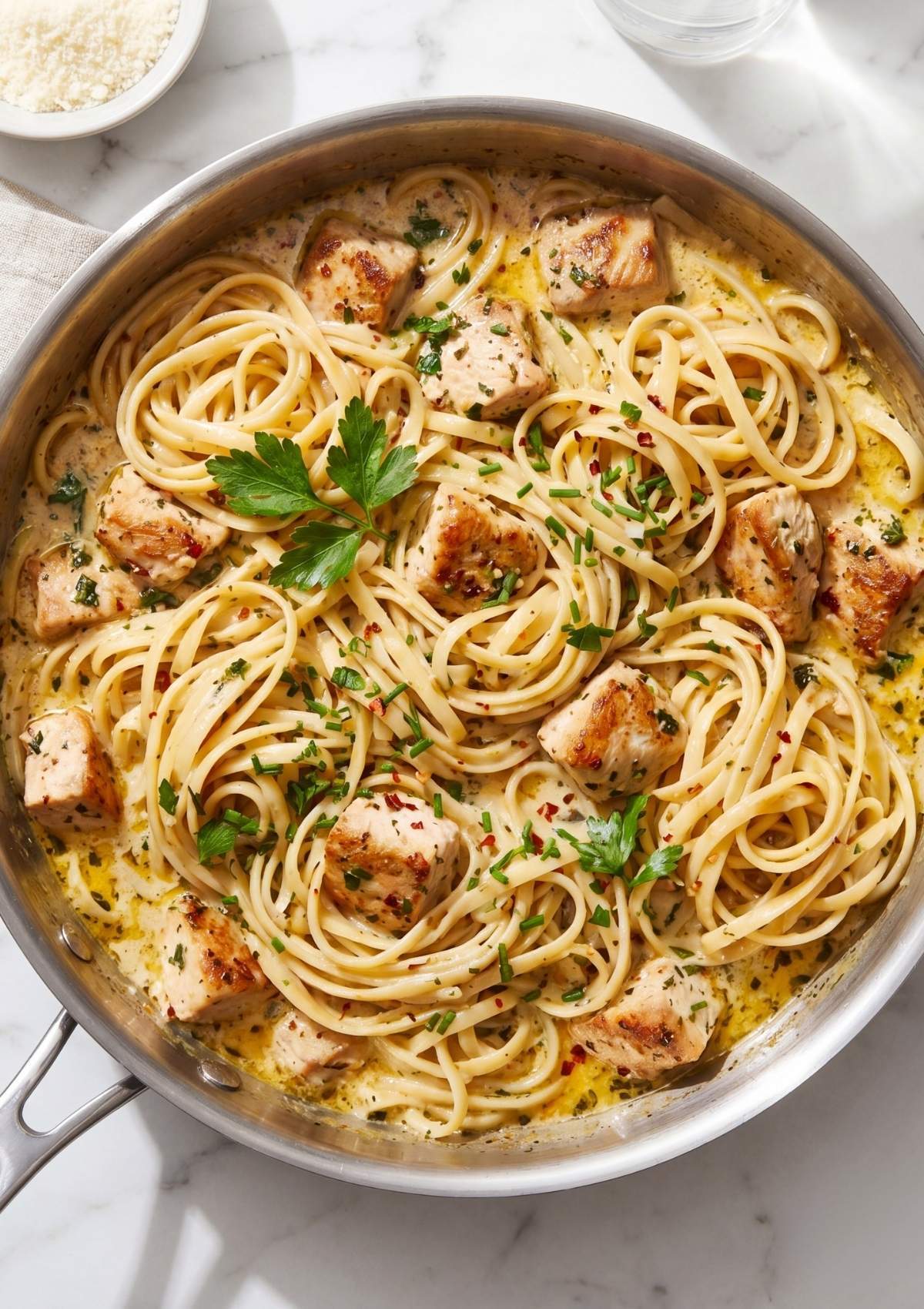 cowboy chicken spaghetti with creamy garlic butter sauce and herbs in skillet easy comfort food