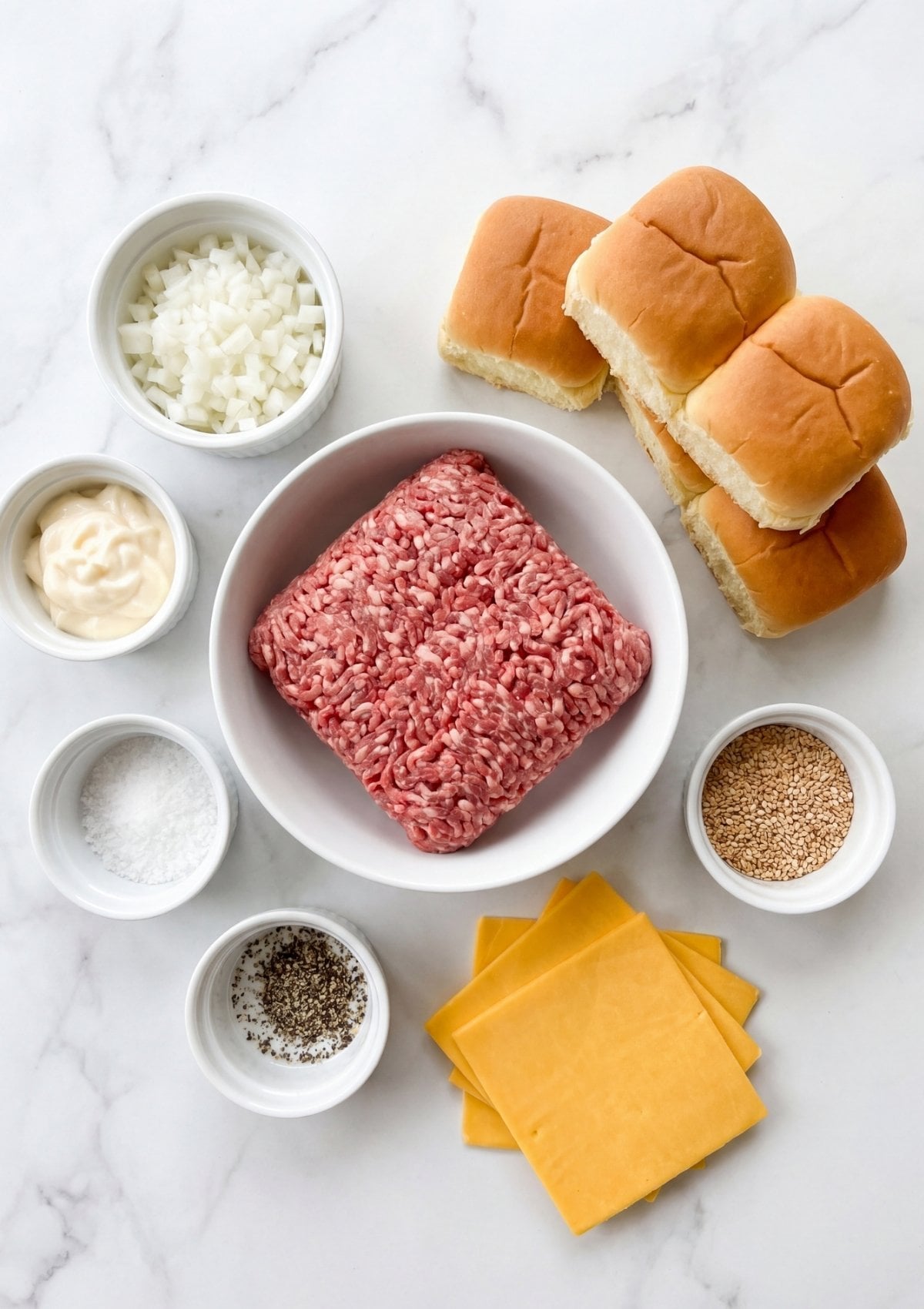 ingredients for wagyu beef sliders including ground beef cheese buns onion and seasoning