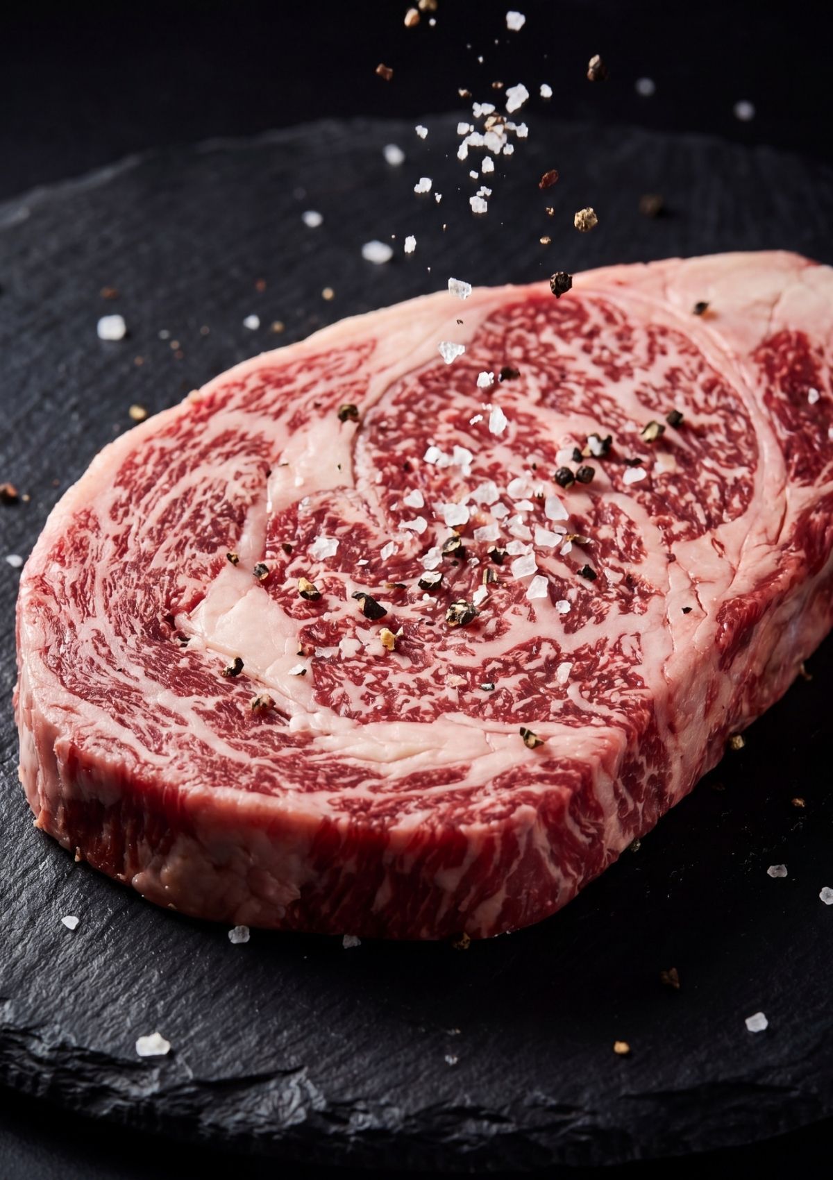 raw wagyu beef steak with salt and pepper for easy wagyu beef sushi recipe prep