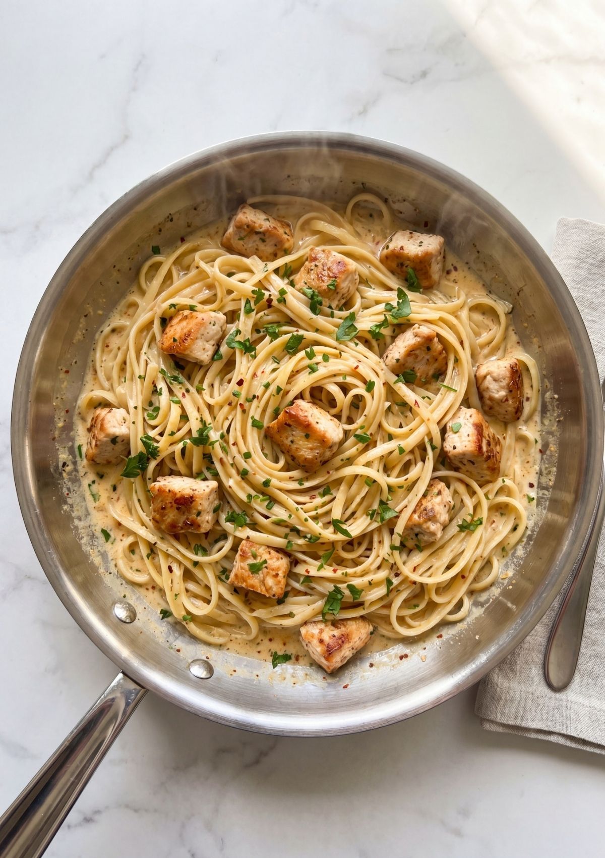 cowboy chicken spaghetti in pan with creamy sauce and golden chicken bites easy weeknight dinner