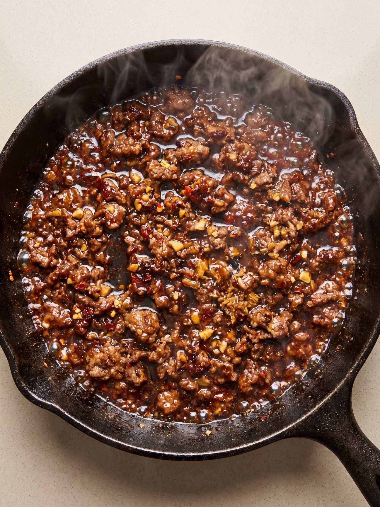 wagyu ground beef recipe cooking in skillet with sticky garlic soy sauce and rich flavor
